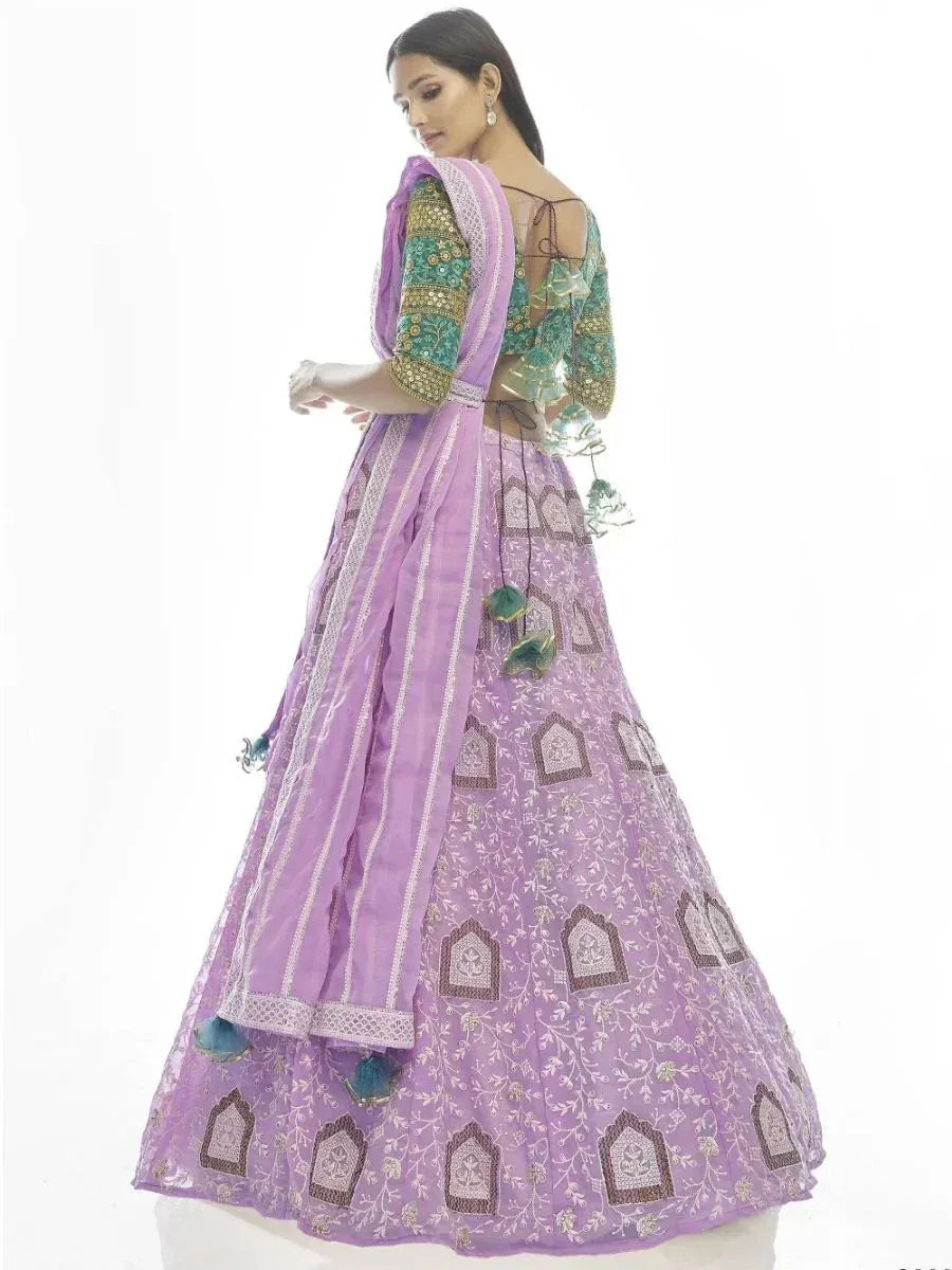 Purple embroidered lehenga choli with green blouse, perfect for Indian ethnic wear occasions