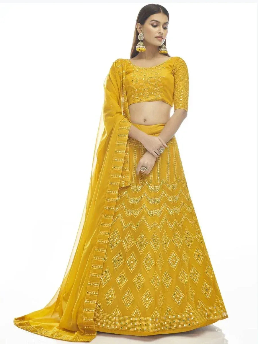 Yellow designer lehenga choli with mirror work and dupatta, ethnic Indian wear for women