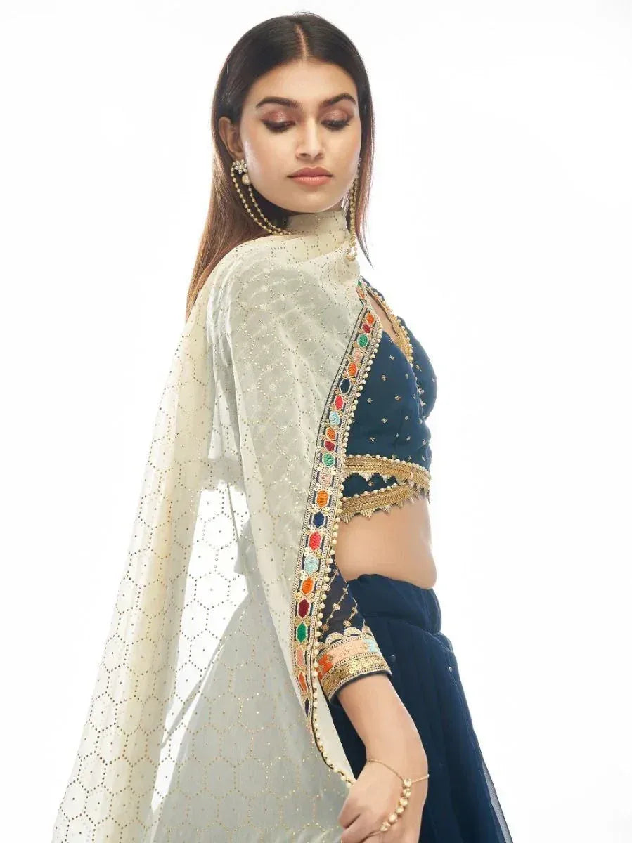 Navy blue designer lehenga choli with embroidered dupatta, perfect for Indian ethnic wear occasions
