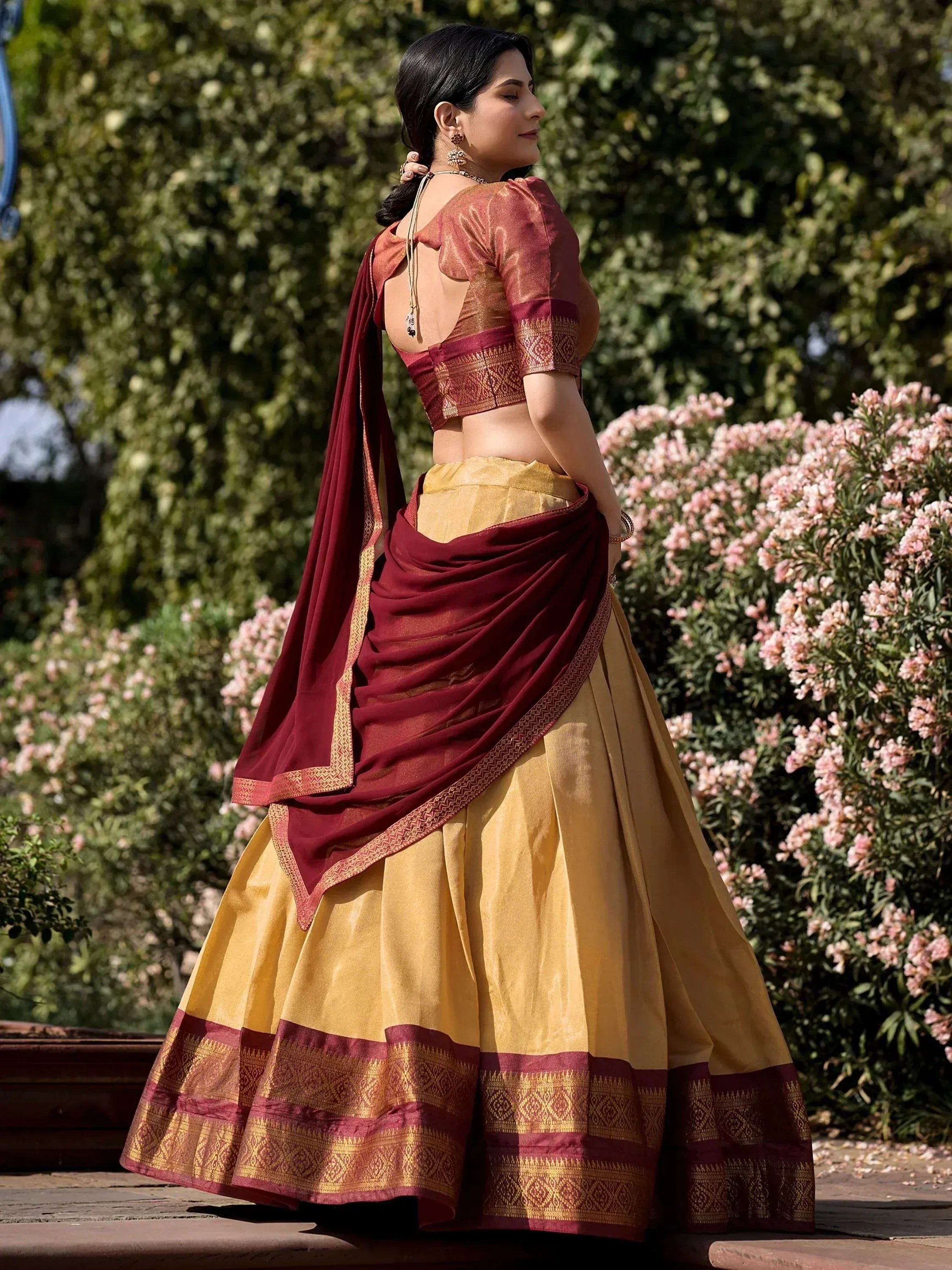 Maroon and gold designer lehenga choli with backless blouse, perfect for Indian ethnic wear occasions