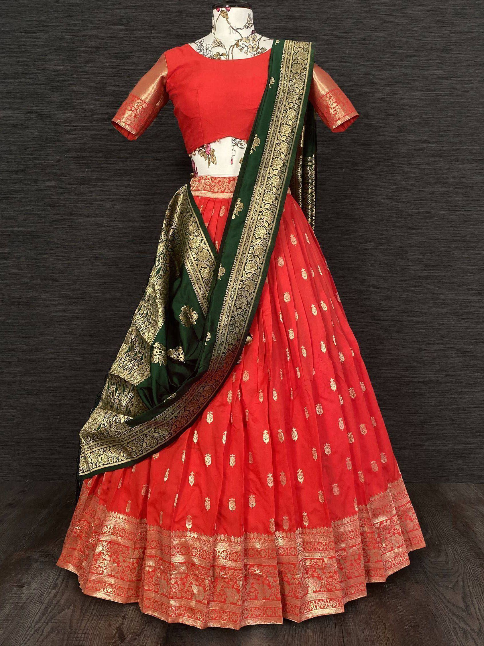Red and green designer lehenga choli with gold embroidery, perfect for Indian ethnic wear occasions