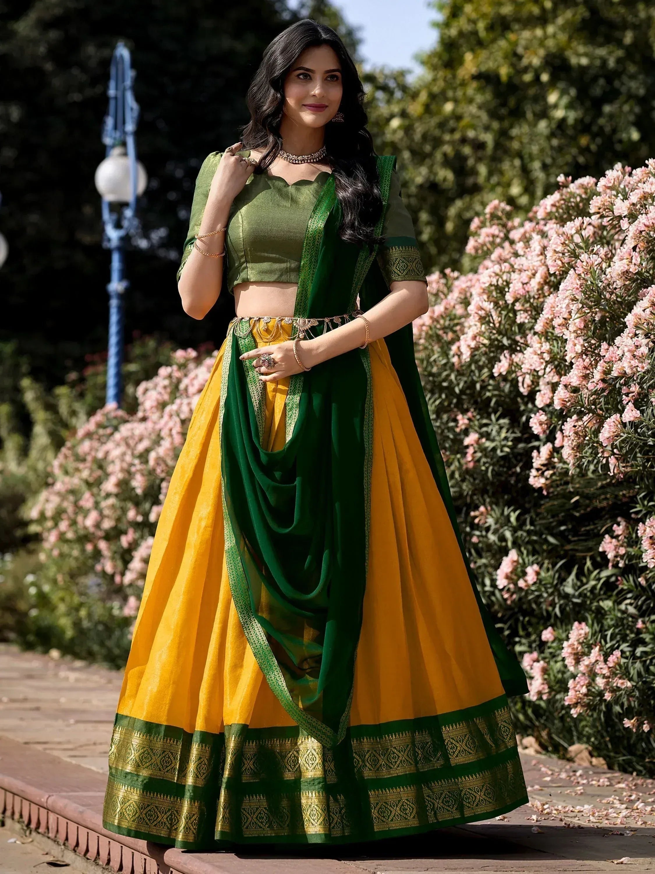 Green and yellow designer lehenga choli with embroidered border, perfect for Indian ethnic occasions