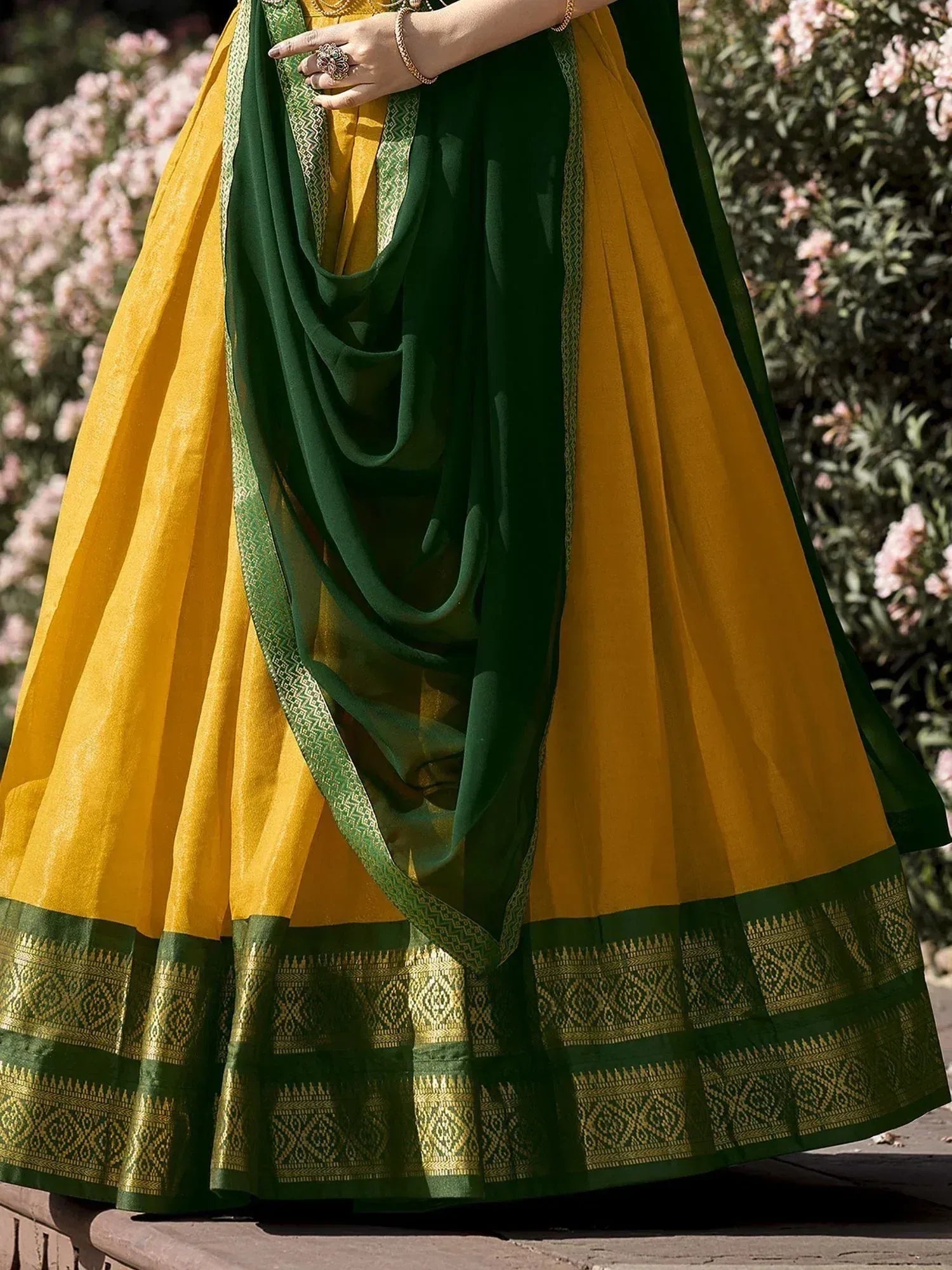 Yellow and green ethnic lehenga choli with embroidered border, perfect for Indian celebrations
