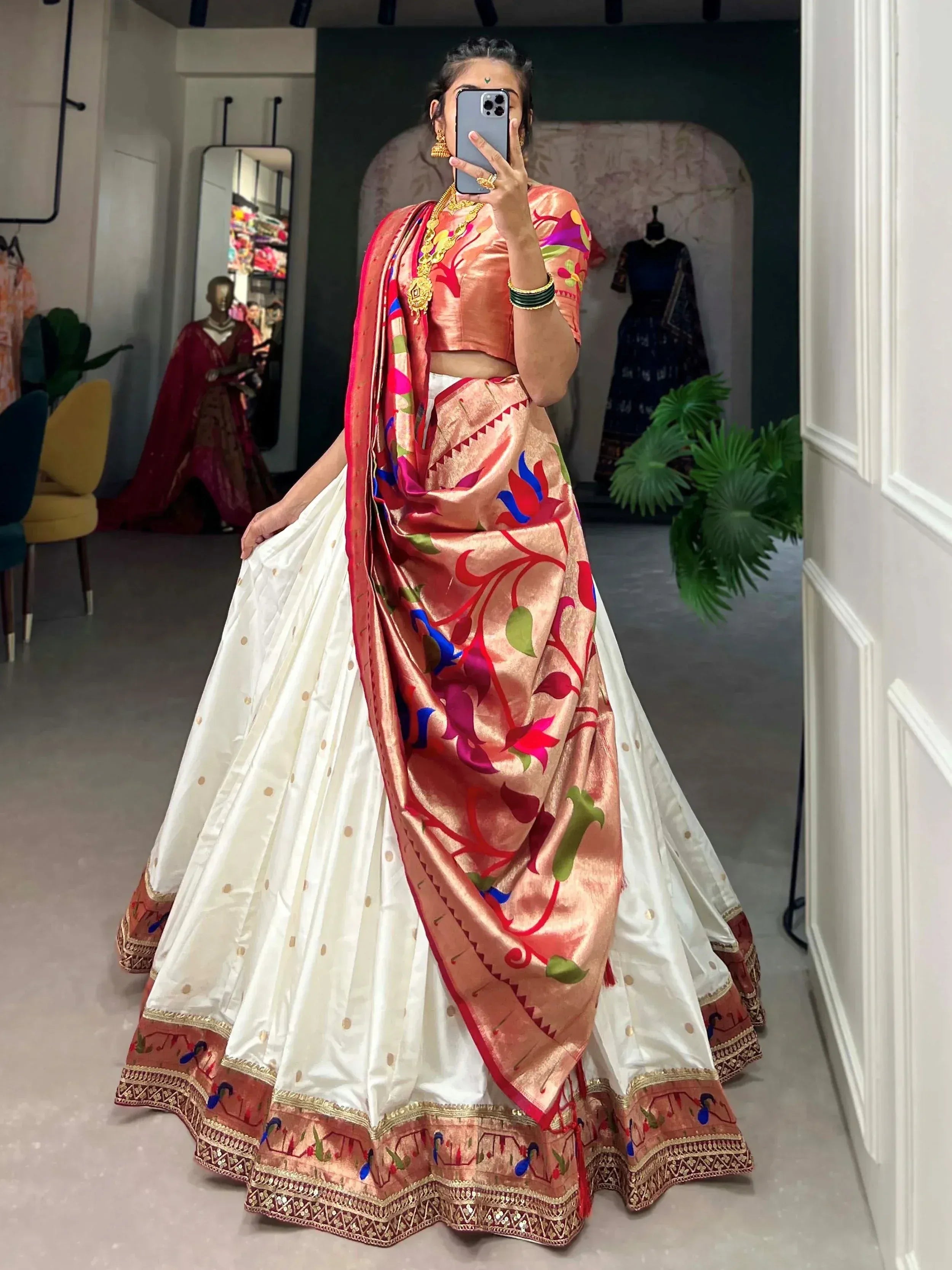 Woman in vibrant floral lehenga choli with white skirt, perfect for Indian ethnic wear occasions