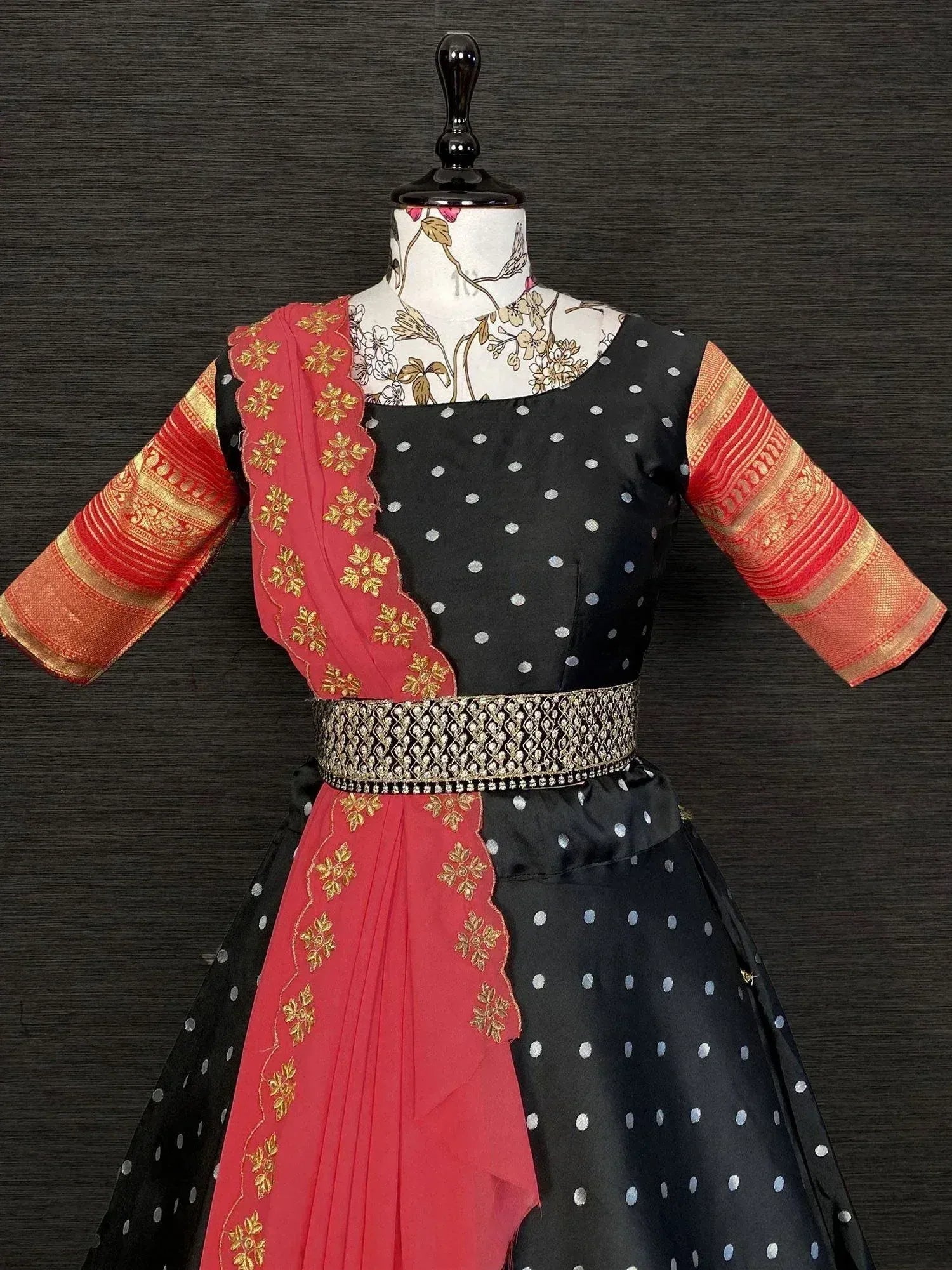 Black polka dot ethnic gown with red gold embroidery and dupatta, perfect for Indian occasions