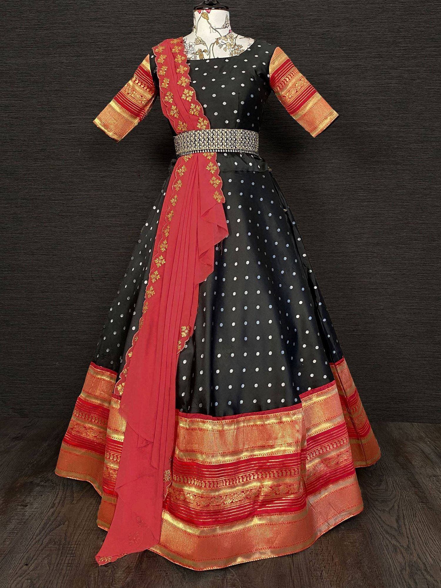 Black polka dot lehenga choli with red gold border and embroidered dupatta, ethnic Indian wear