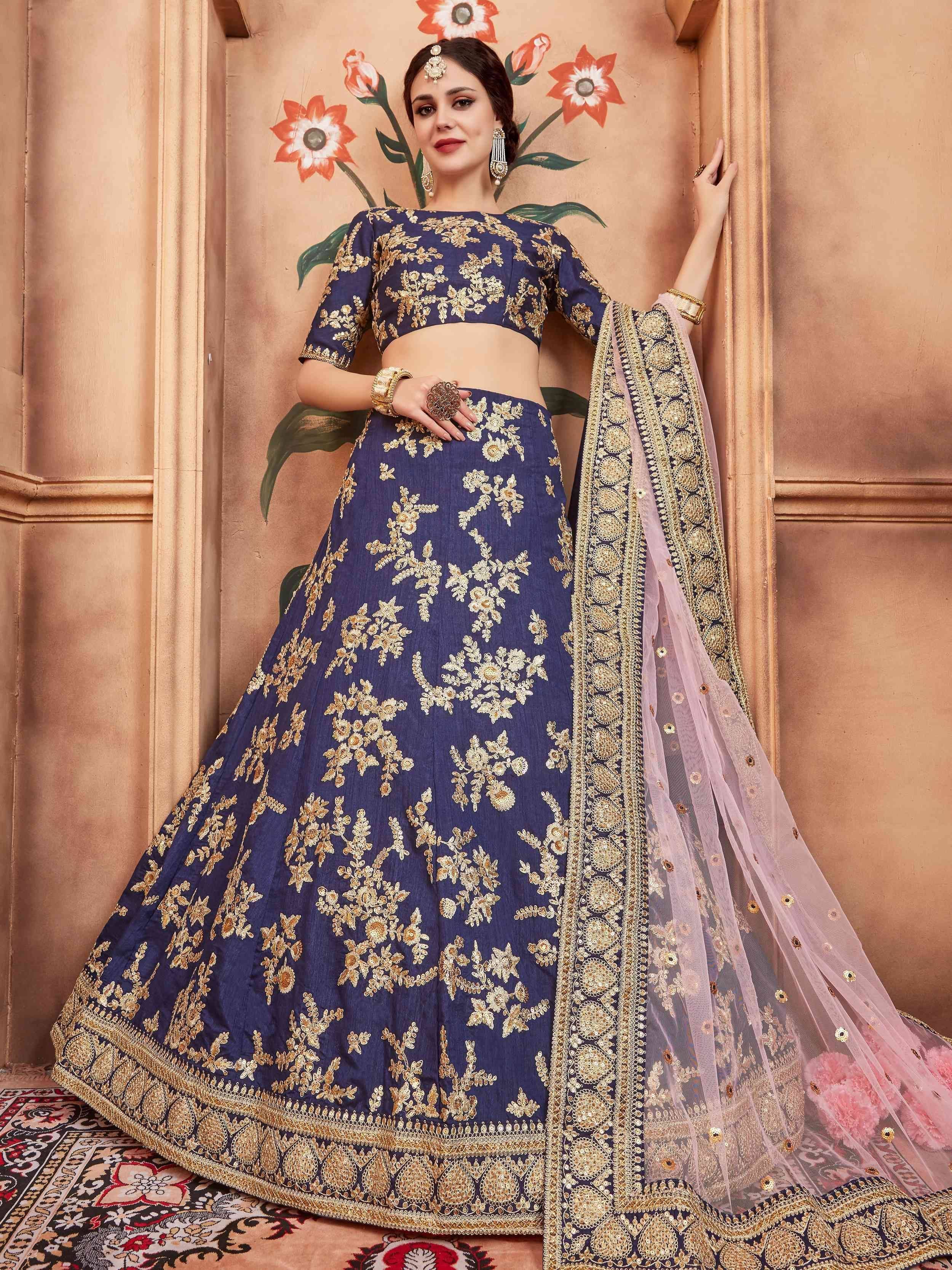 Navy blue designer lehenga choli with gold floral embroidery and sheer dupatta, perfect for Indian weddings and festivals
