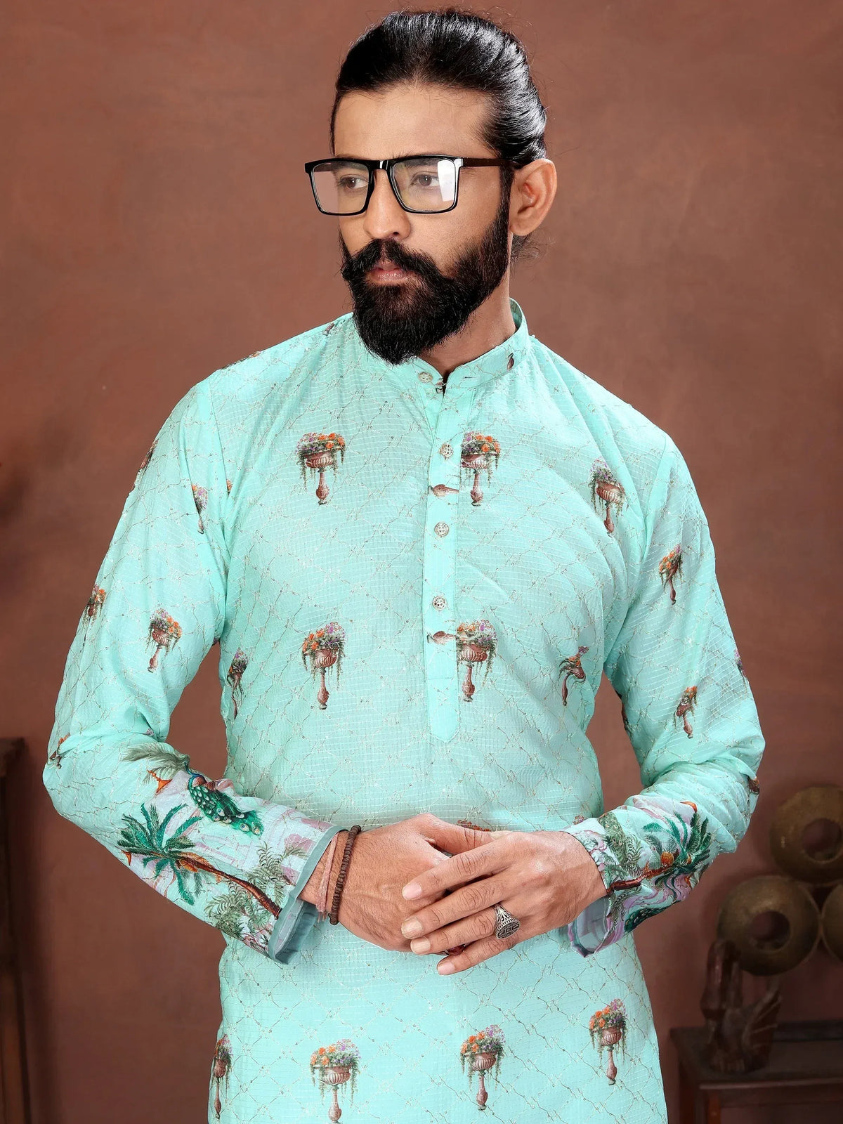 Man wearing a mint green printed ethnic kurta with a mandarin collar