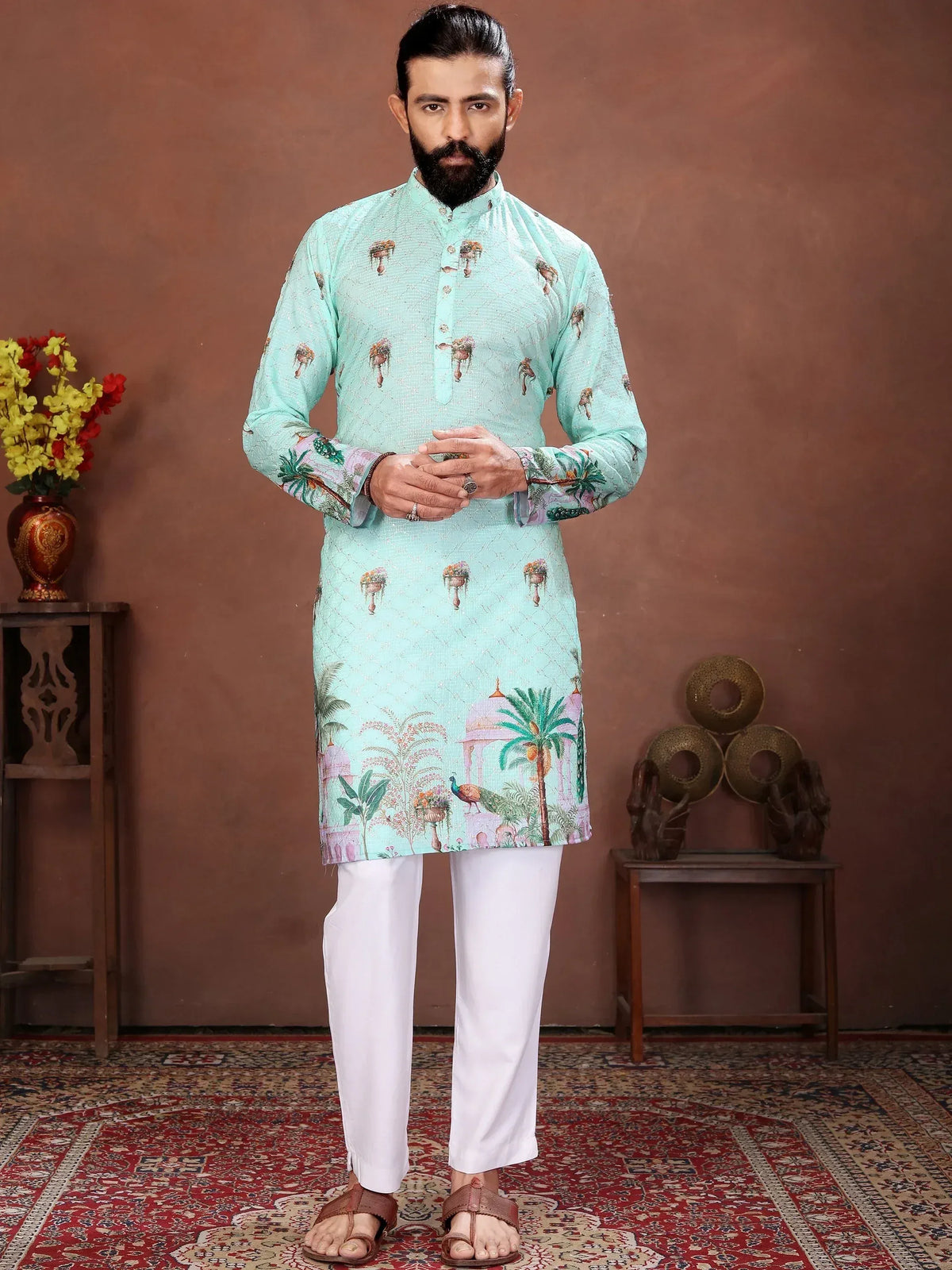 Man wearing a light blue printed ethnic kurta with white trousers
