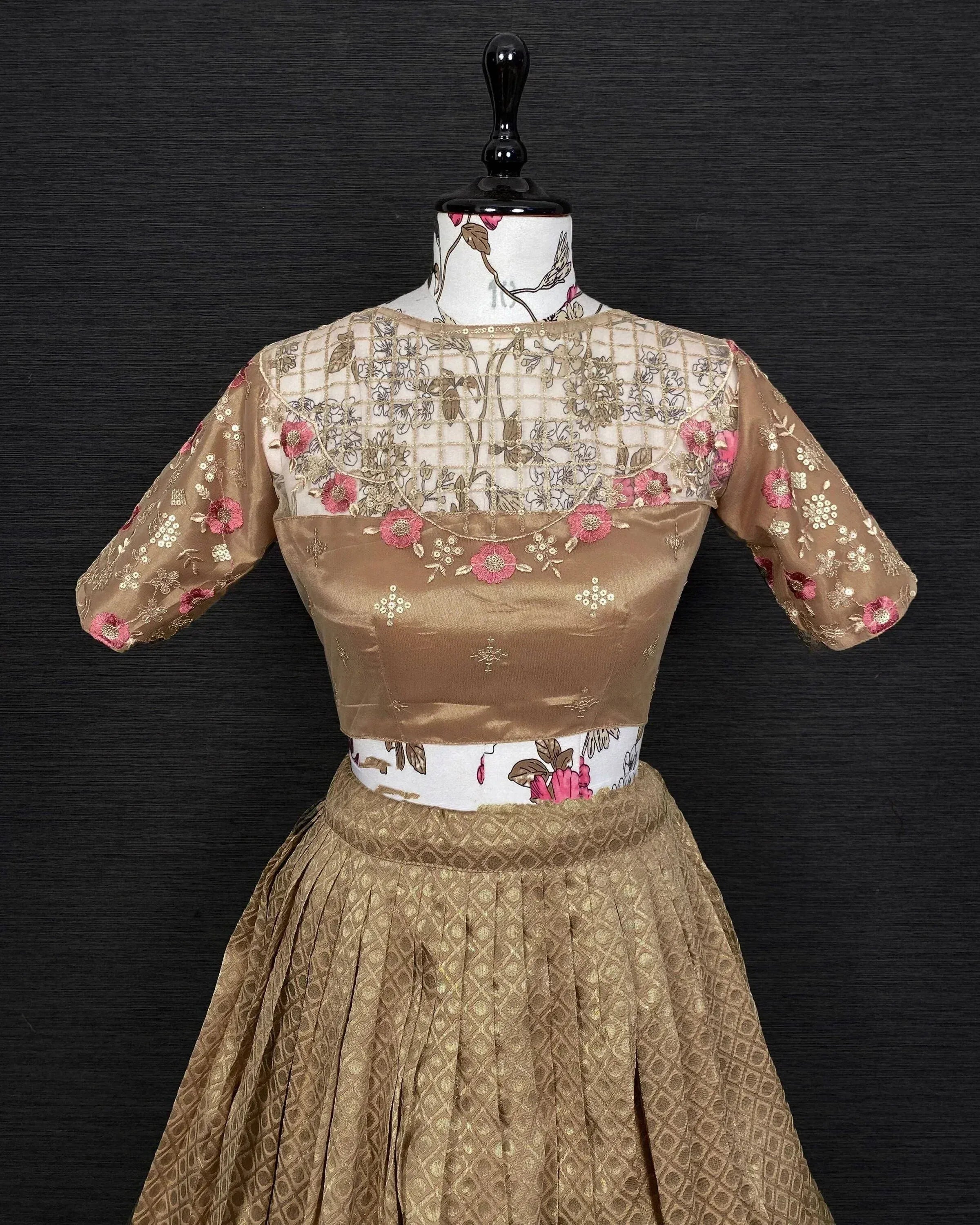 Golden floral embroidered lehenga choli with sheer net blouse, perfect for Indian ethnic wear occasions