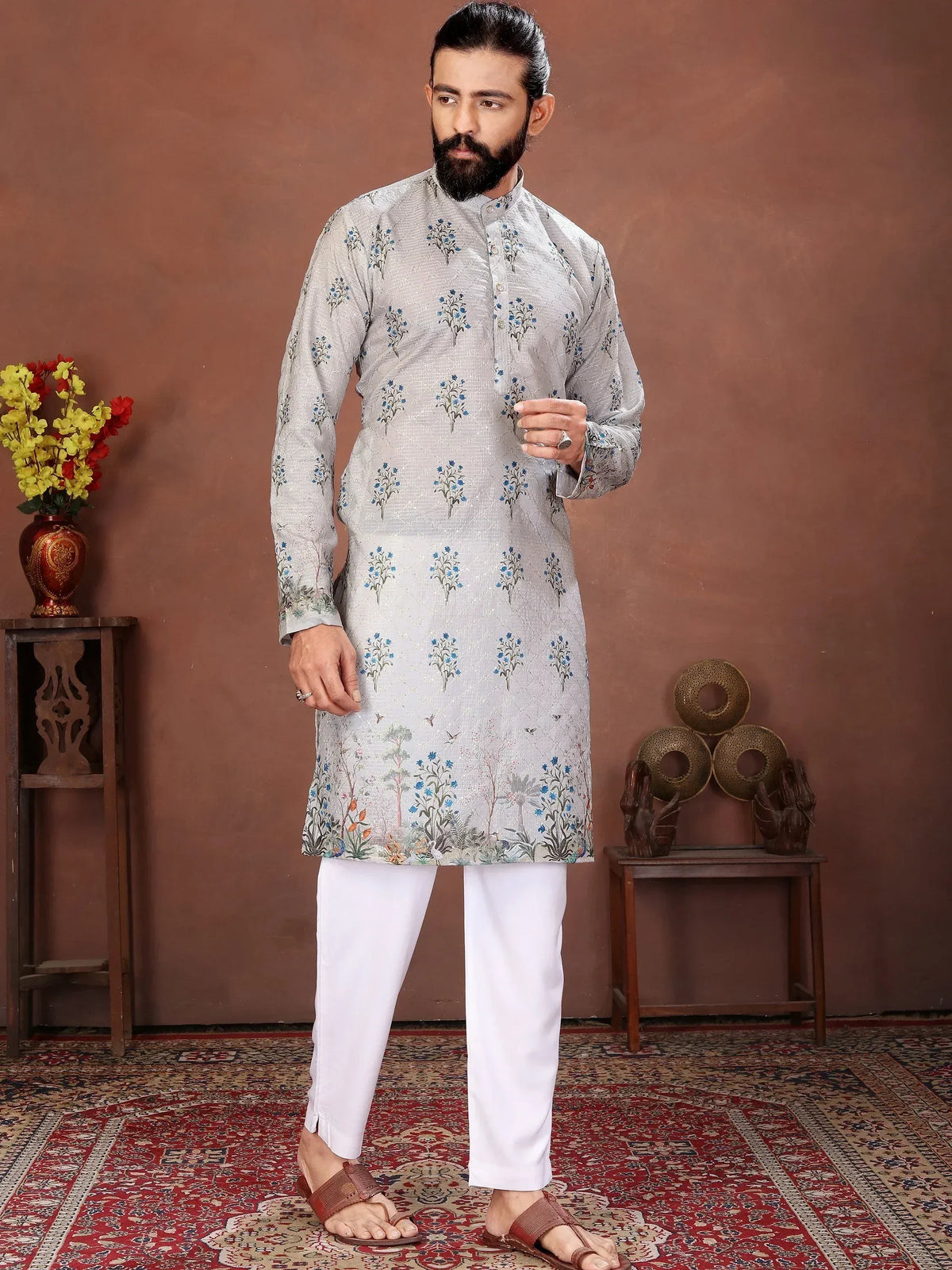 Man wearing a grey floral print ethnic kurta with white trousers