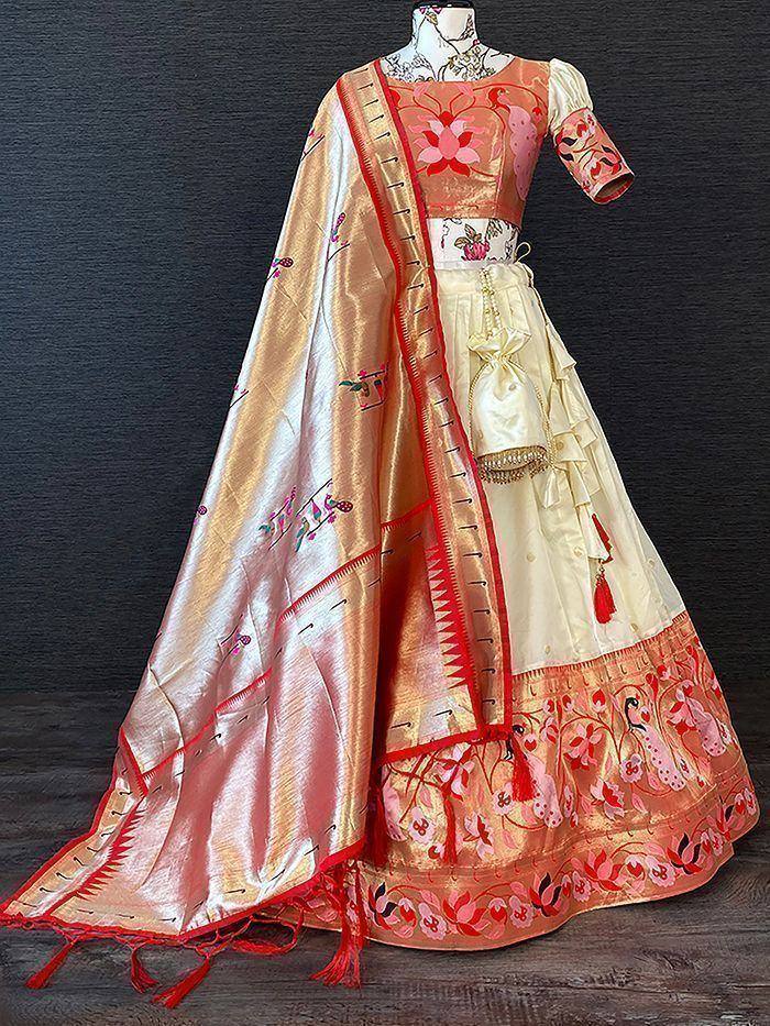 Elegant peach and cream lehenga choli with floral embroidery and red border, perfect for Indian ethnic occasions
