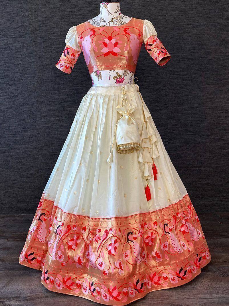 Pink floral embroidered lehenga choli with ruffled skirt and matching potli bag, ideal for Indian ethnic wear occasions