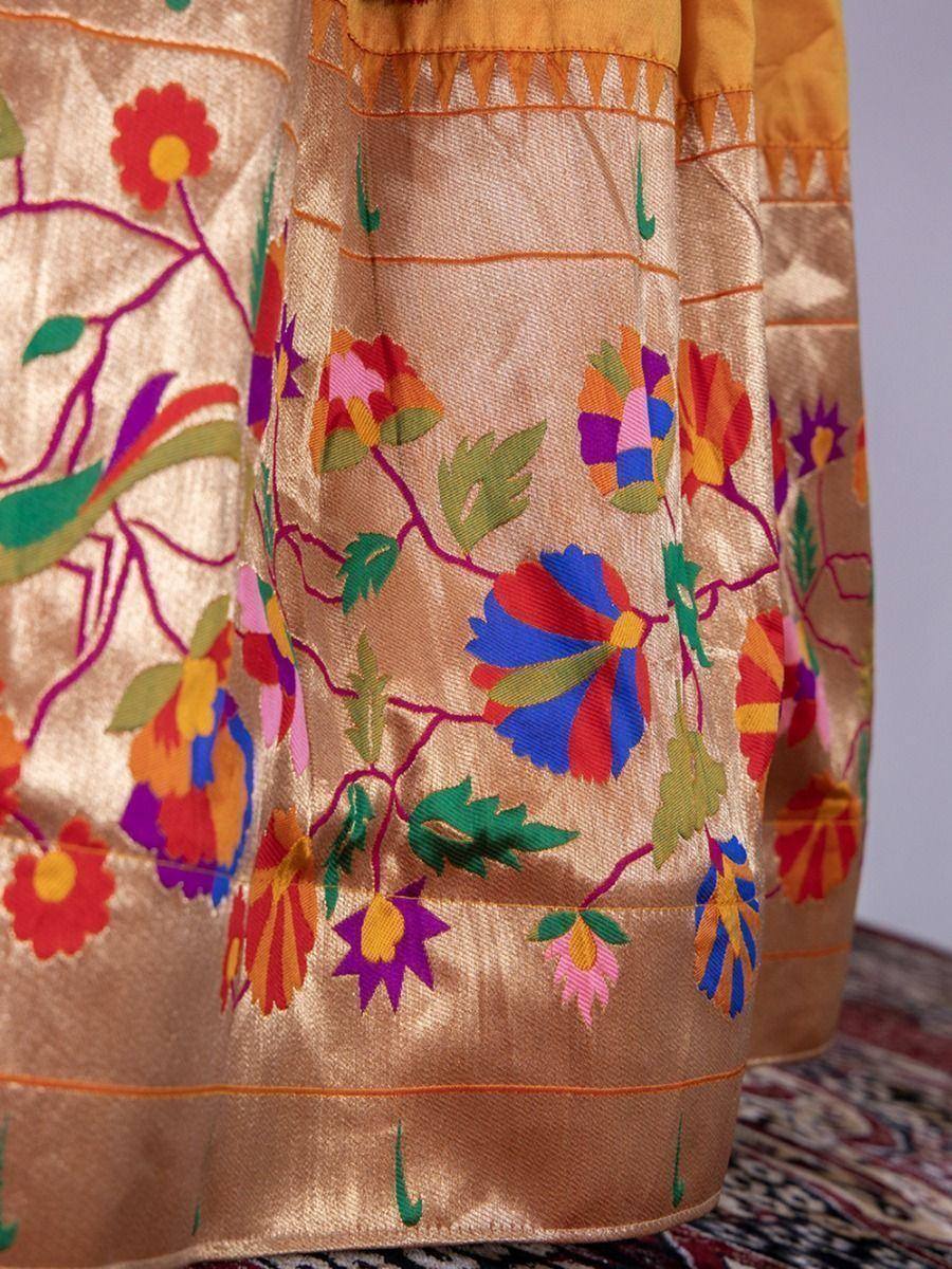 Vibrant floral embroidery on golden ethnic gown, perfect for Indian celebrations and festive occasions.