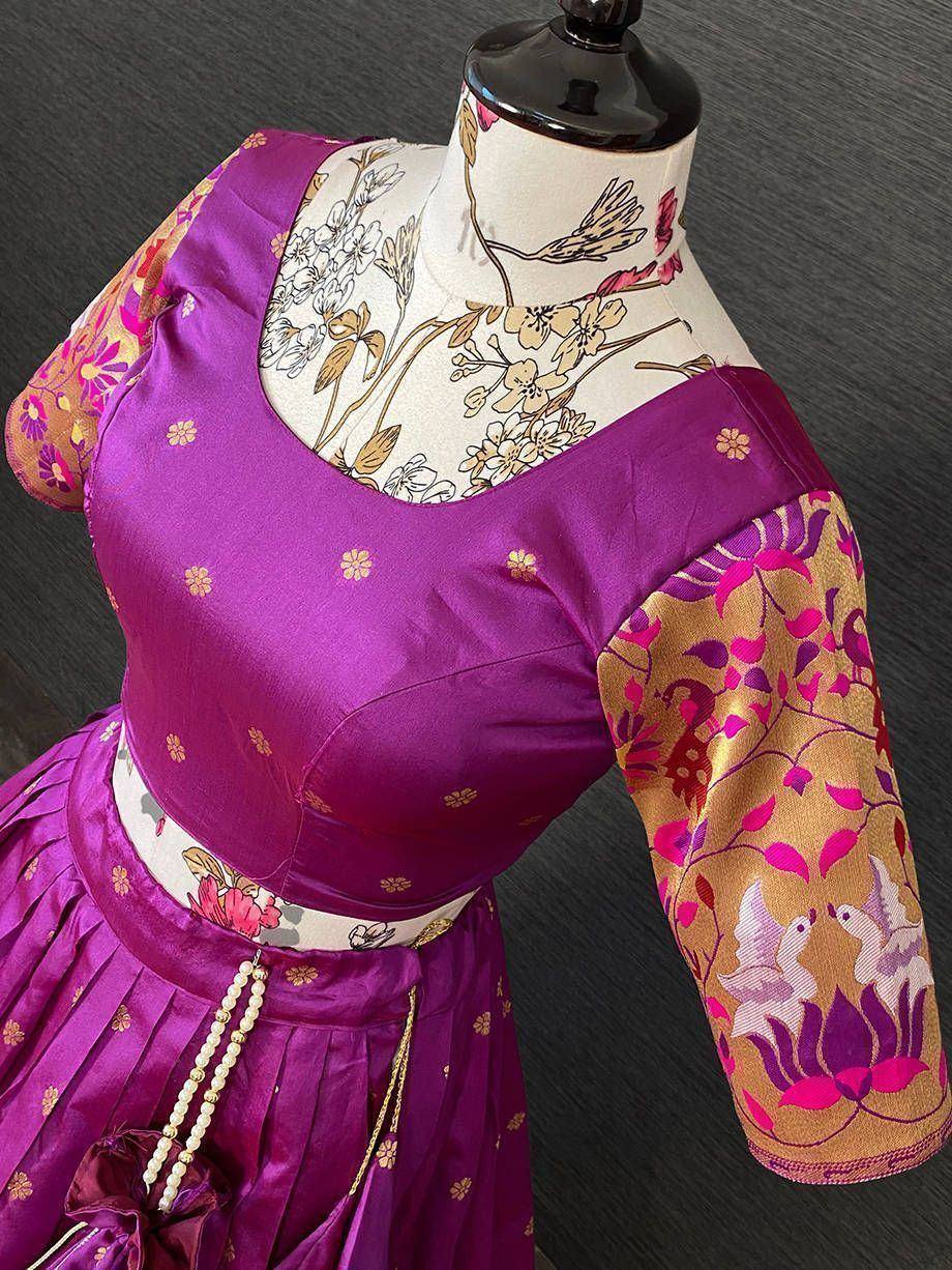 Purple floral lehenga choli with embroidered sleeves and pearl tassels, perfect for Indian ethnic wear occasions