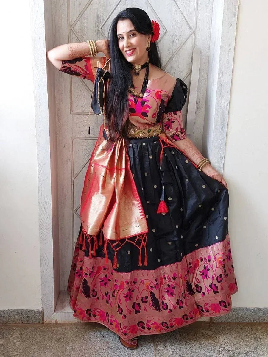 Woman in black and pink floral embroidered ethnic gown with gold belt and dupatta, perfect for Indian festive occasions.
