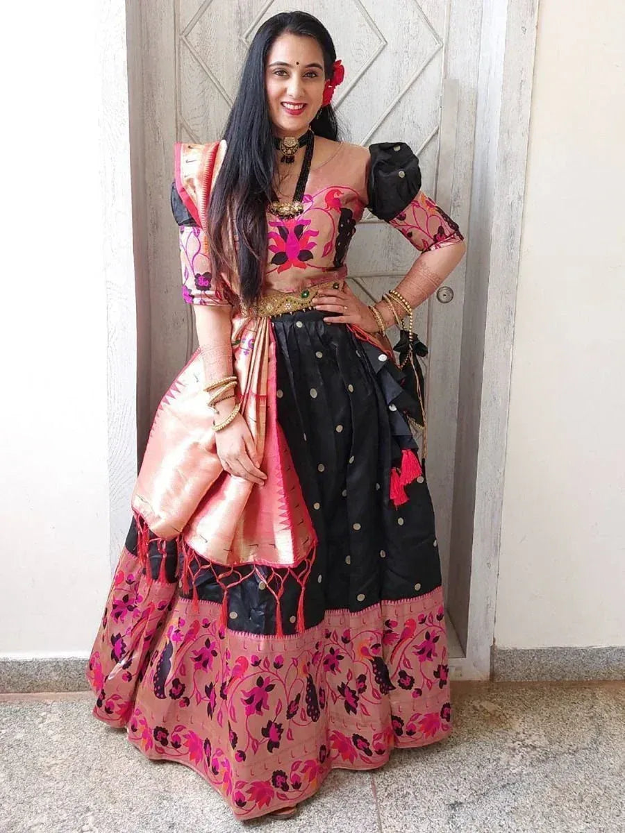 Woman in pink and black floral lehenga choli with puff sleeves, ethnic Indian wear