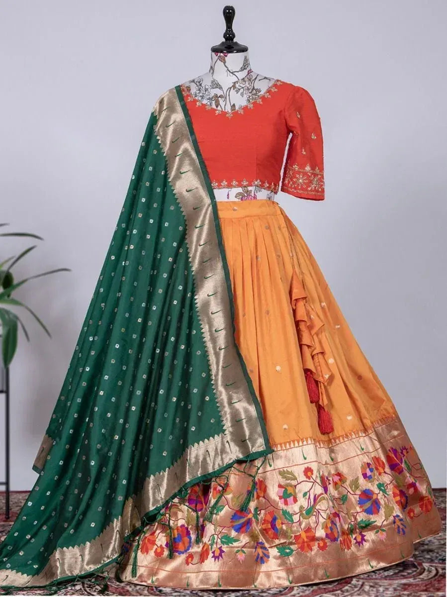 Orange embroidered lehenga choli with green dupatta, floral border, perfect for Indian ethnic occasions
