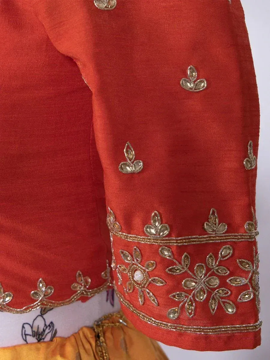 Red ethnic blouse with gold floral embroidery and mirror work, perfect for Indian wear