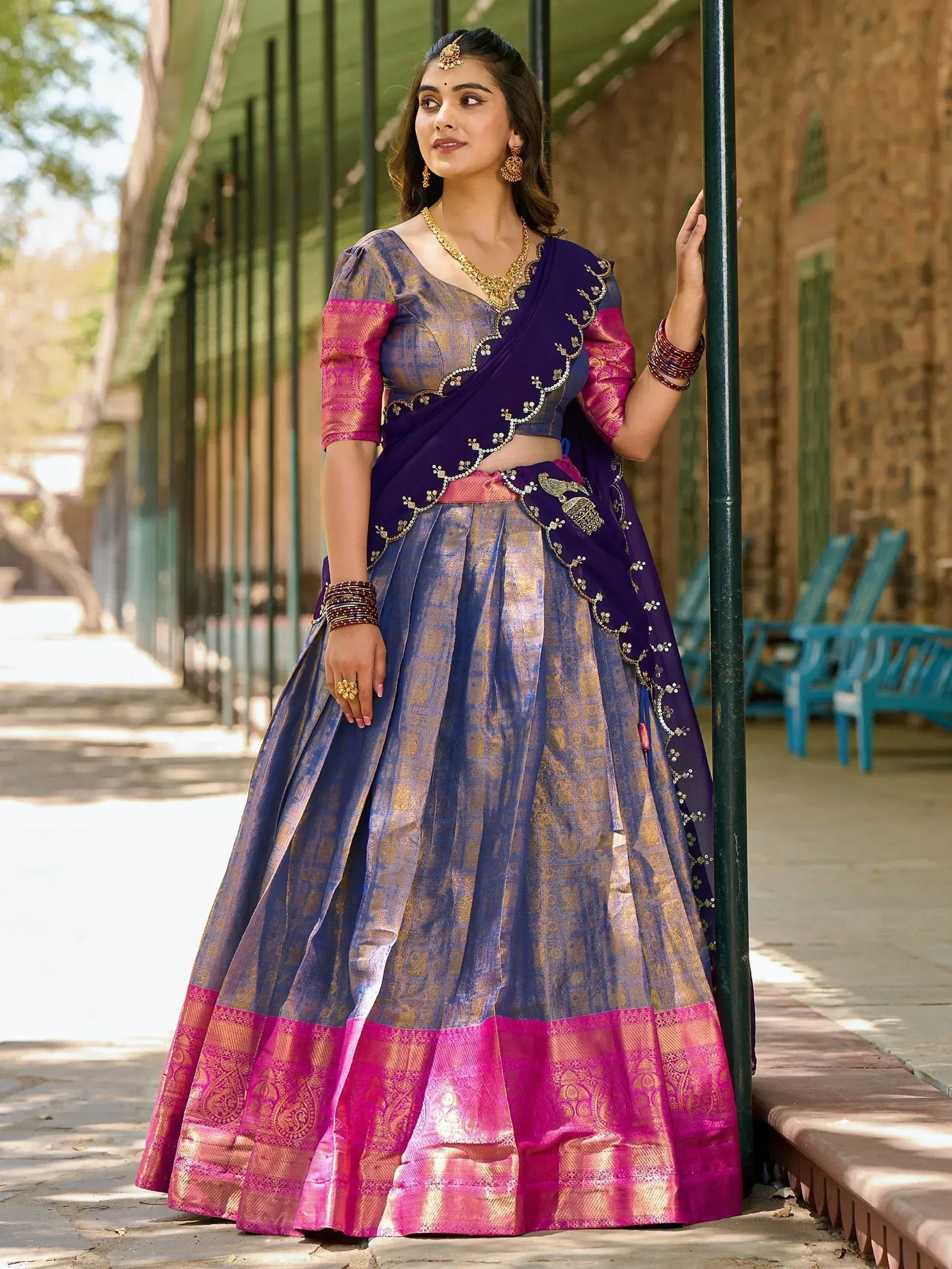 Elegant purple and pink designer lehenga choli with gold embroidery, perfect for Indian ethnic occasions