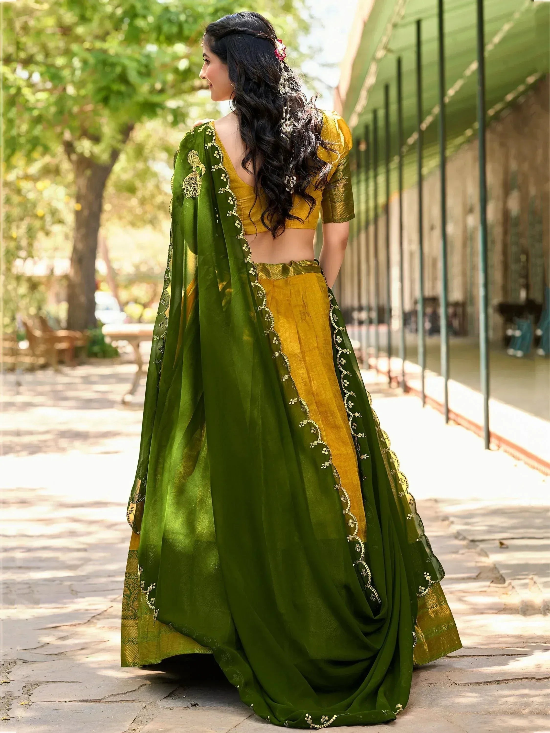 Green and gold designer lehenga choli with floral embroidery, perfect for Indian ethnic occasions