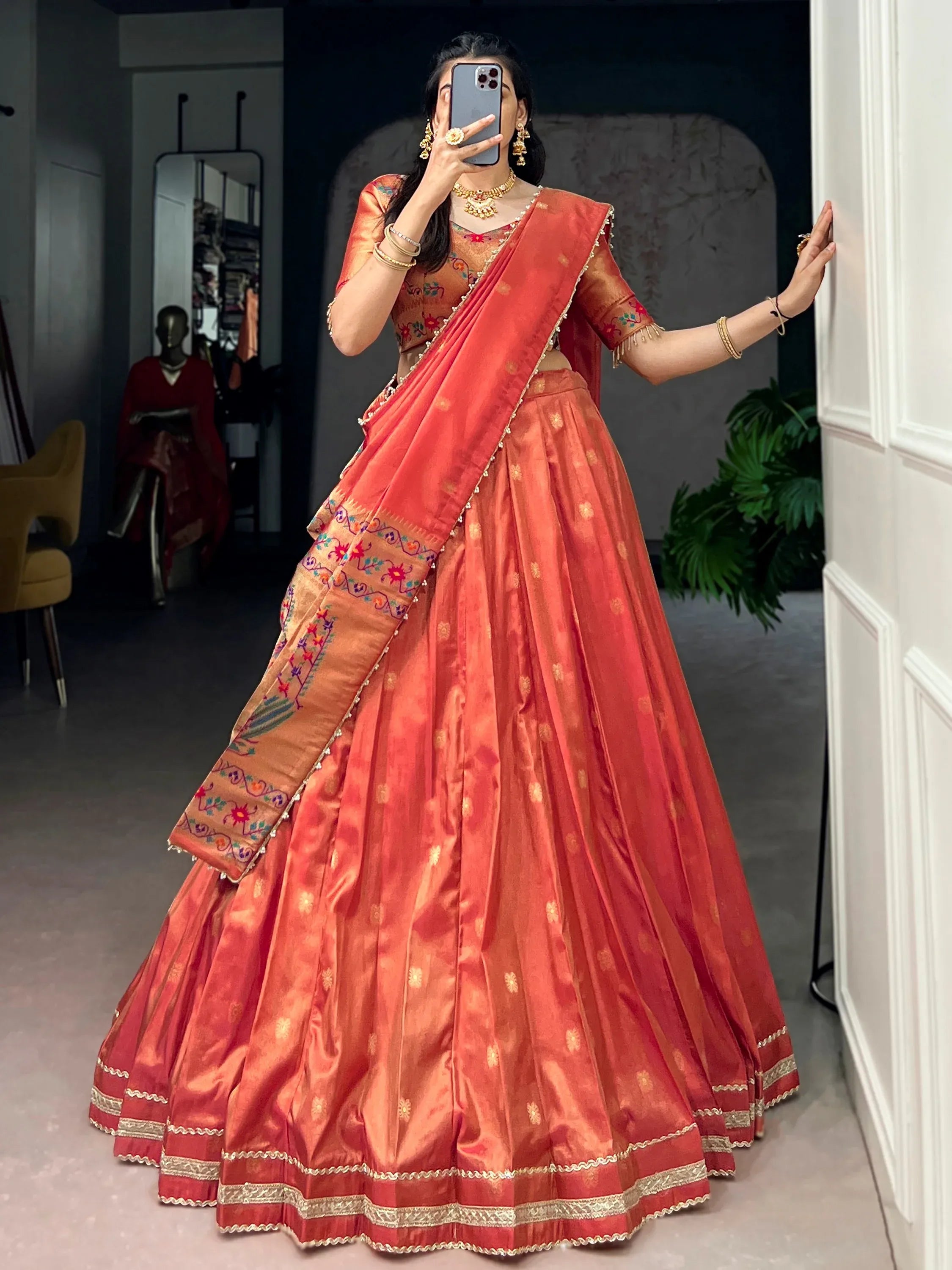 Wonderful Orange Zari Weaving Shimmer Festive Wear Lehenga Choli