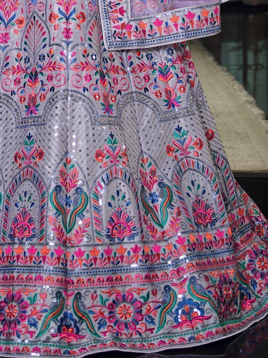 Grey lehenga with vibrant floral and peacock embroidery, perfect for Indian ethnic wear occasions.