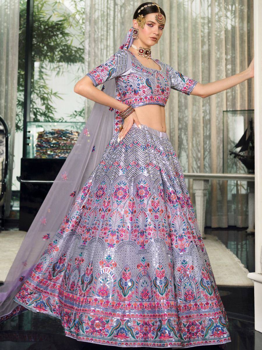 Elegant lavender lehenga choli with floral embroidery, perfect for Indian weddings and festive occasions.