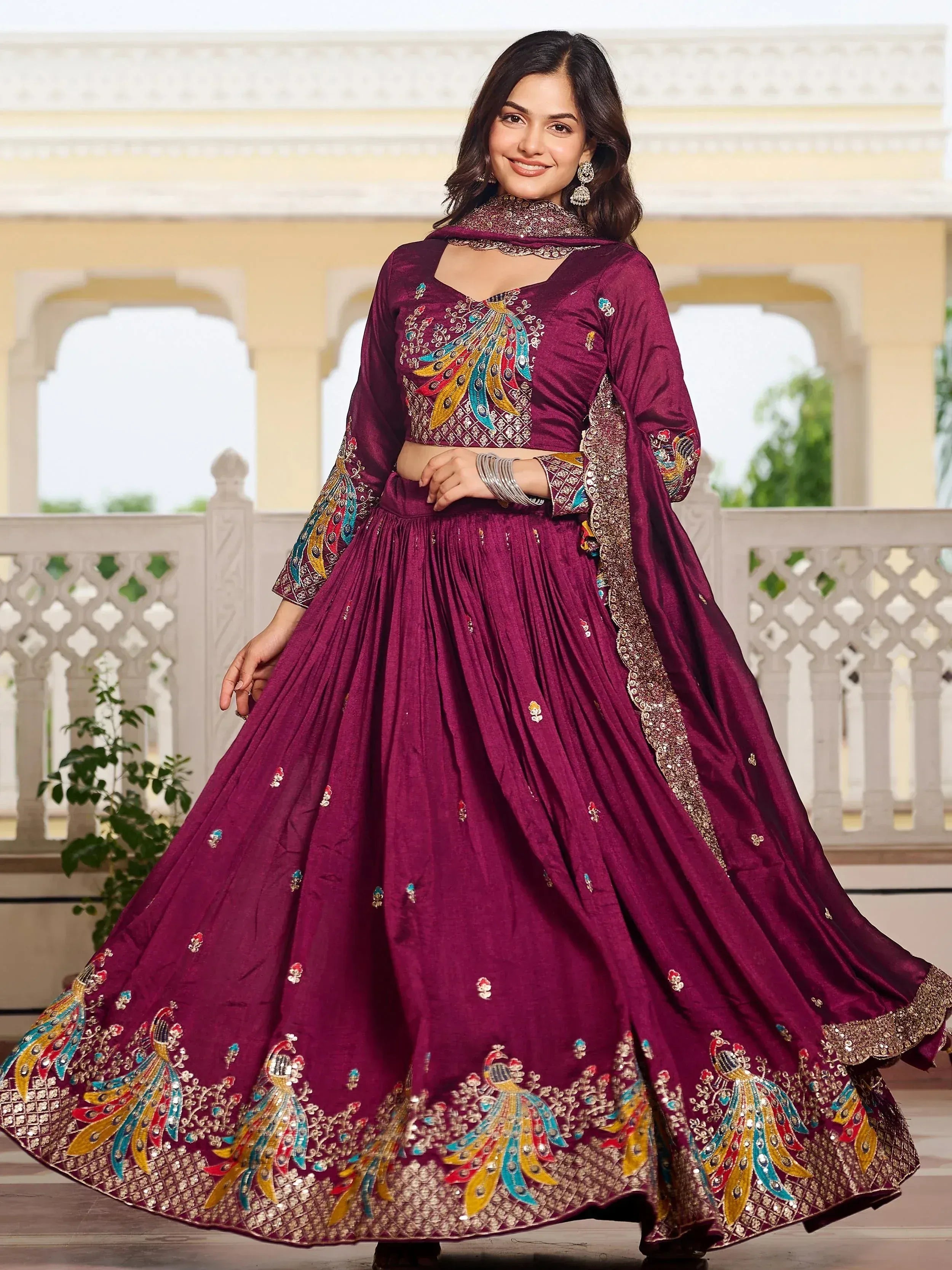 Elegant maroon lehenga choli with peacock embroidery, perfect for Indian ethnic occasions and weddings.