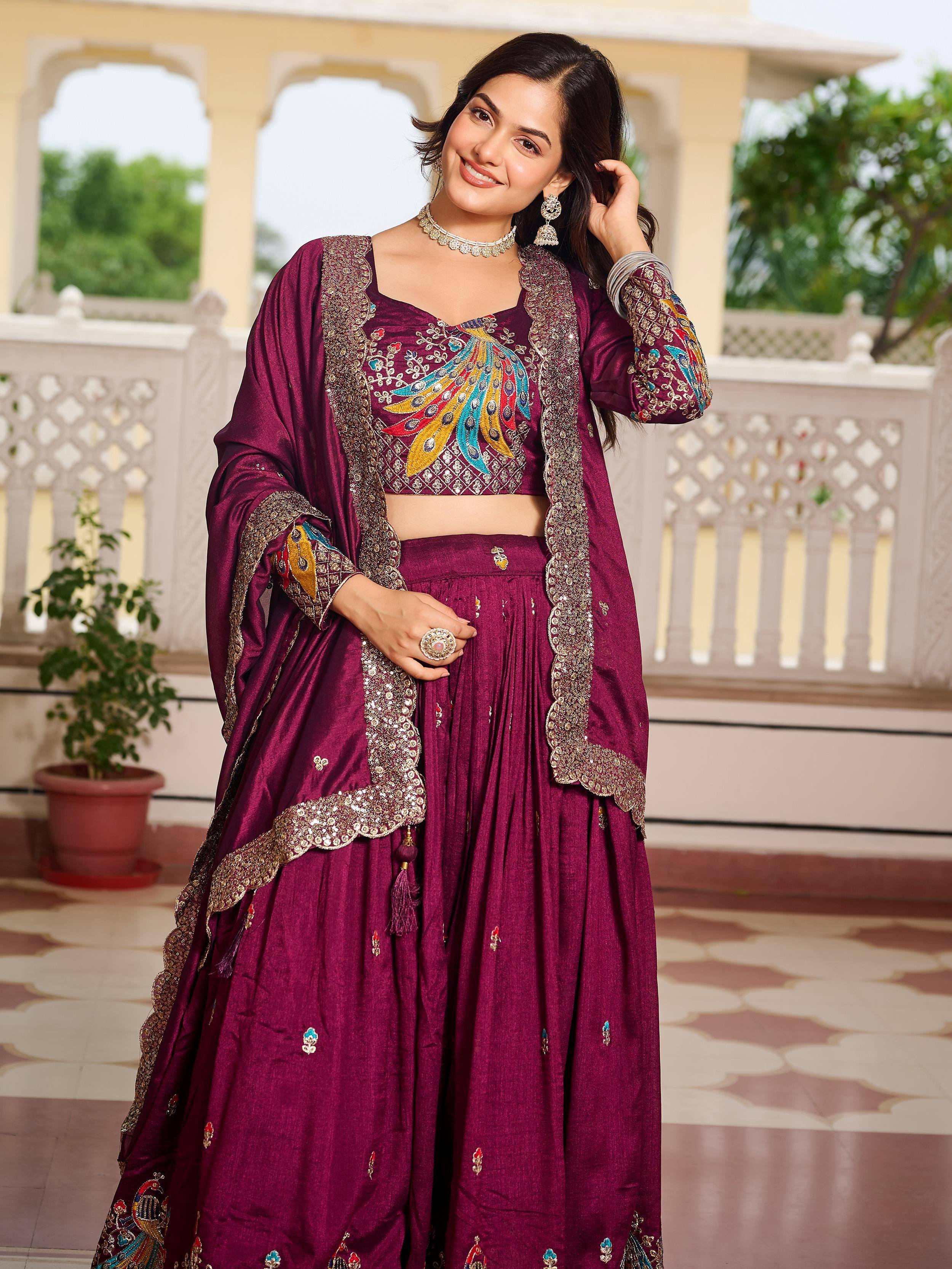 Purple embroidered lehenga choli with peacock design, perfect for Indian ethnic wear and festive occasions.