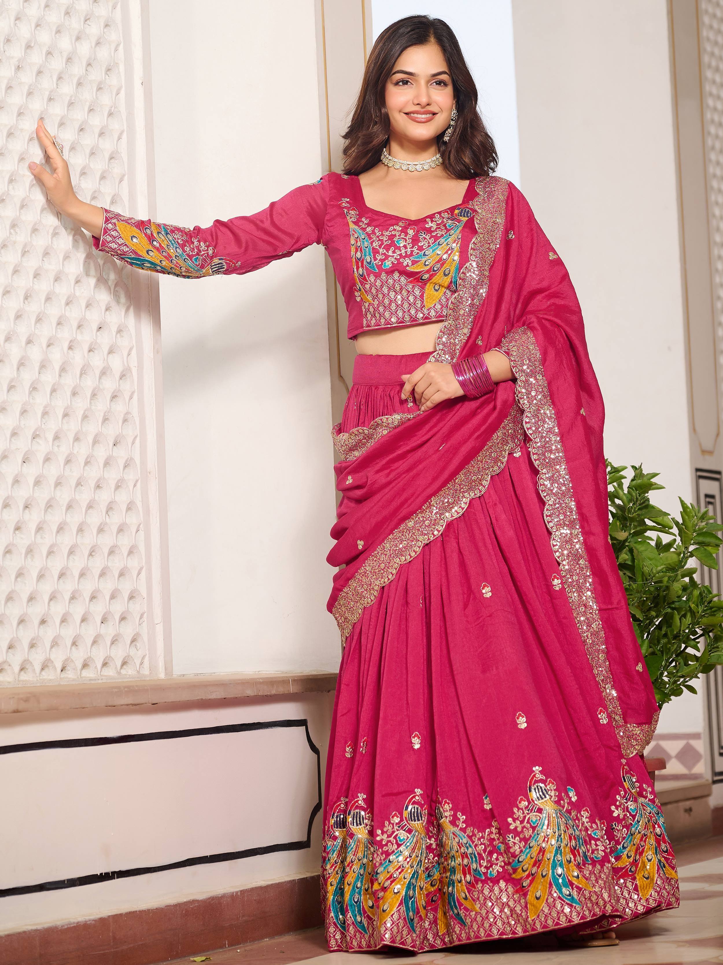 Pink embroidered lehenga choli with peacock motifs, perfect for Indian ethnic wear and festive occasions.