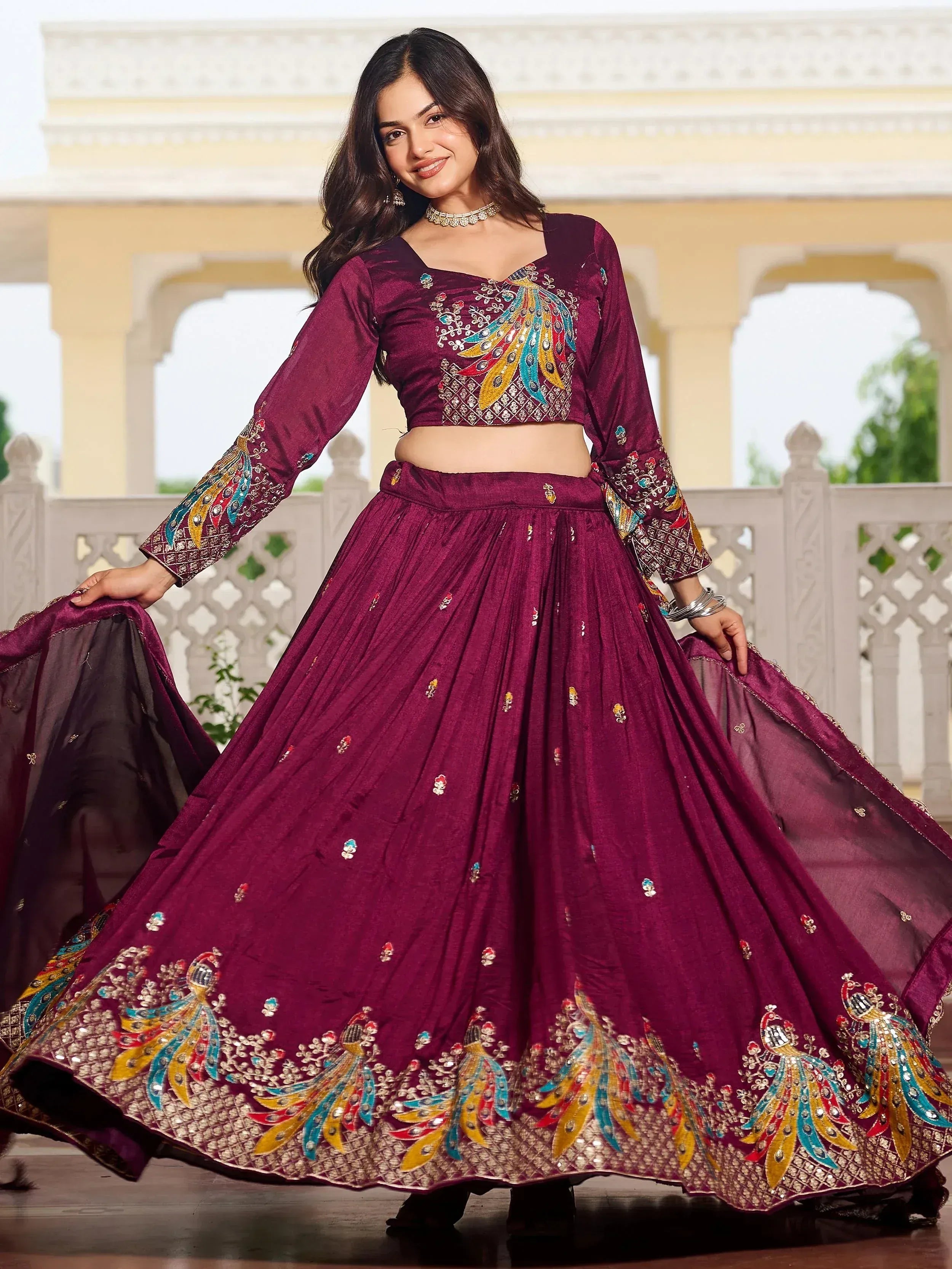 Elegant maroon lehenga choli with peacock embroidery, perfect for Indian ethnic wear and festive occasions.