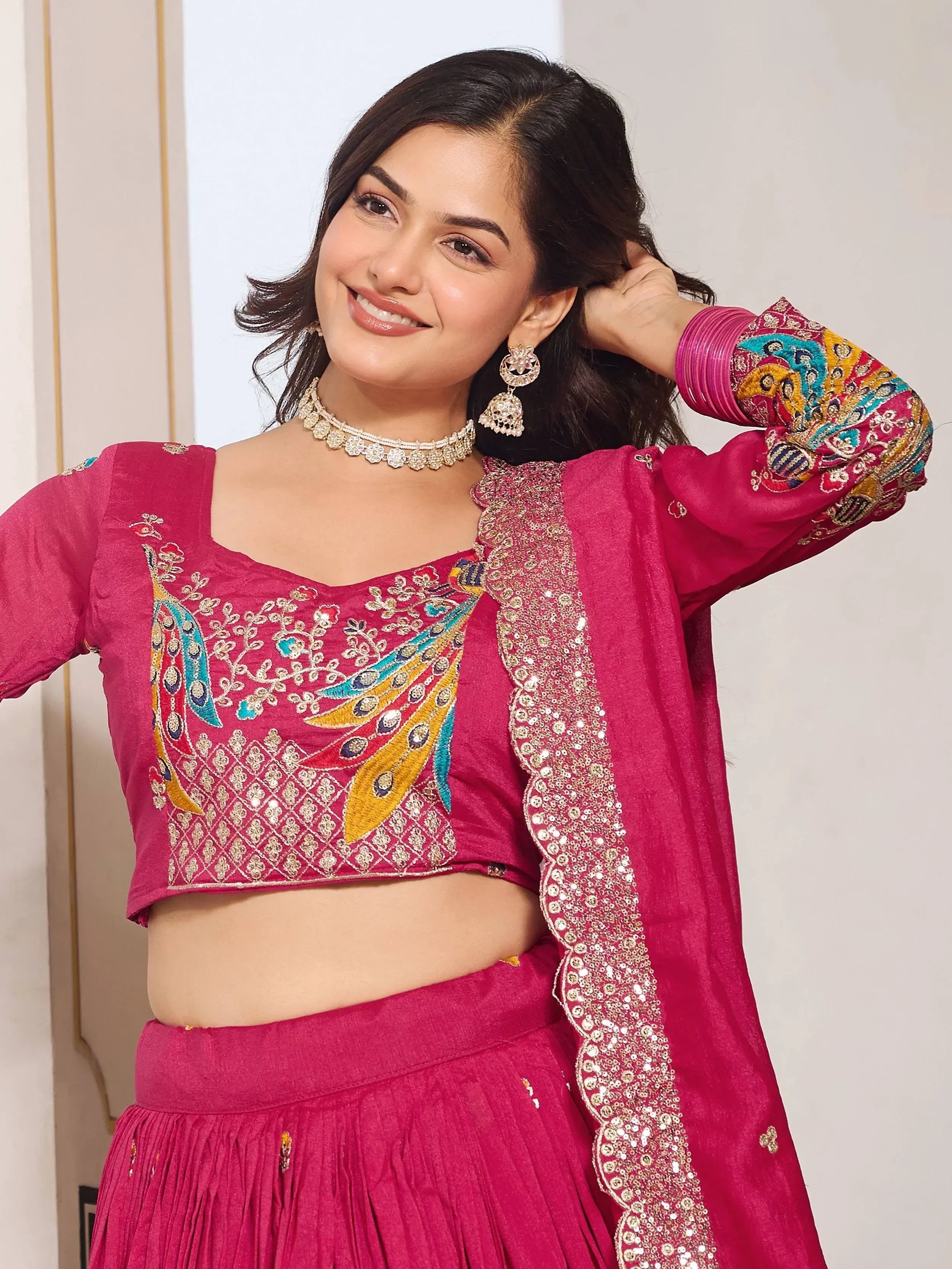 Pink embroidered lehenga choli with peacock design, perfect for Indian ethnic wear occasions