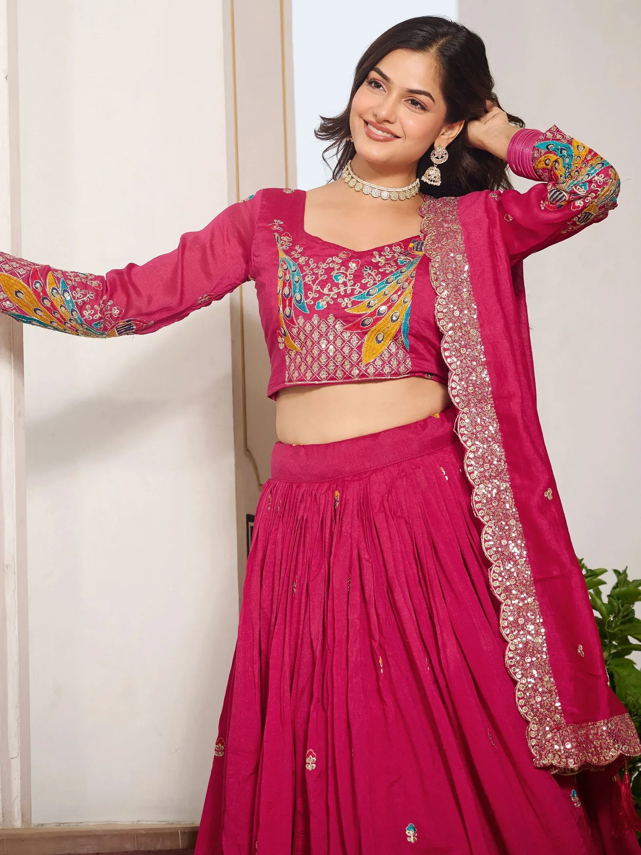 Pink embroidered lehenga choli with peacock design, perfect for Indian ethnic wear and festive occasions.