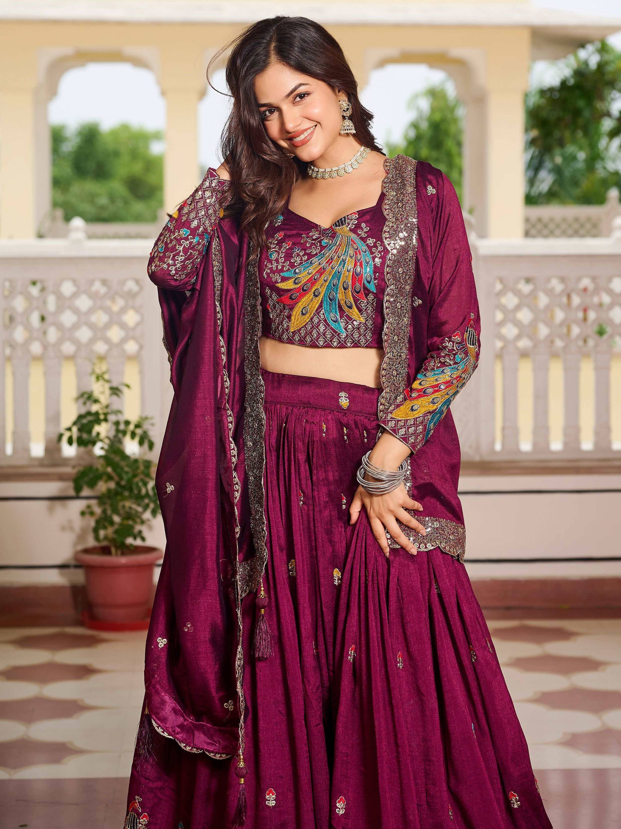 Woman in maroon Indian lehenga choli with peacock embroidery, perfect for ethnic wear events