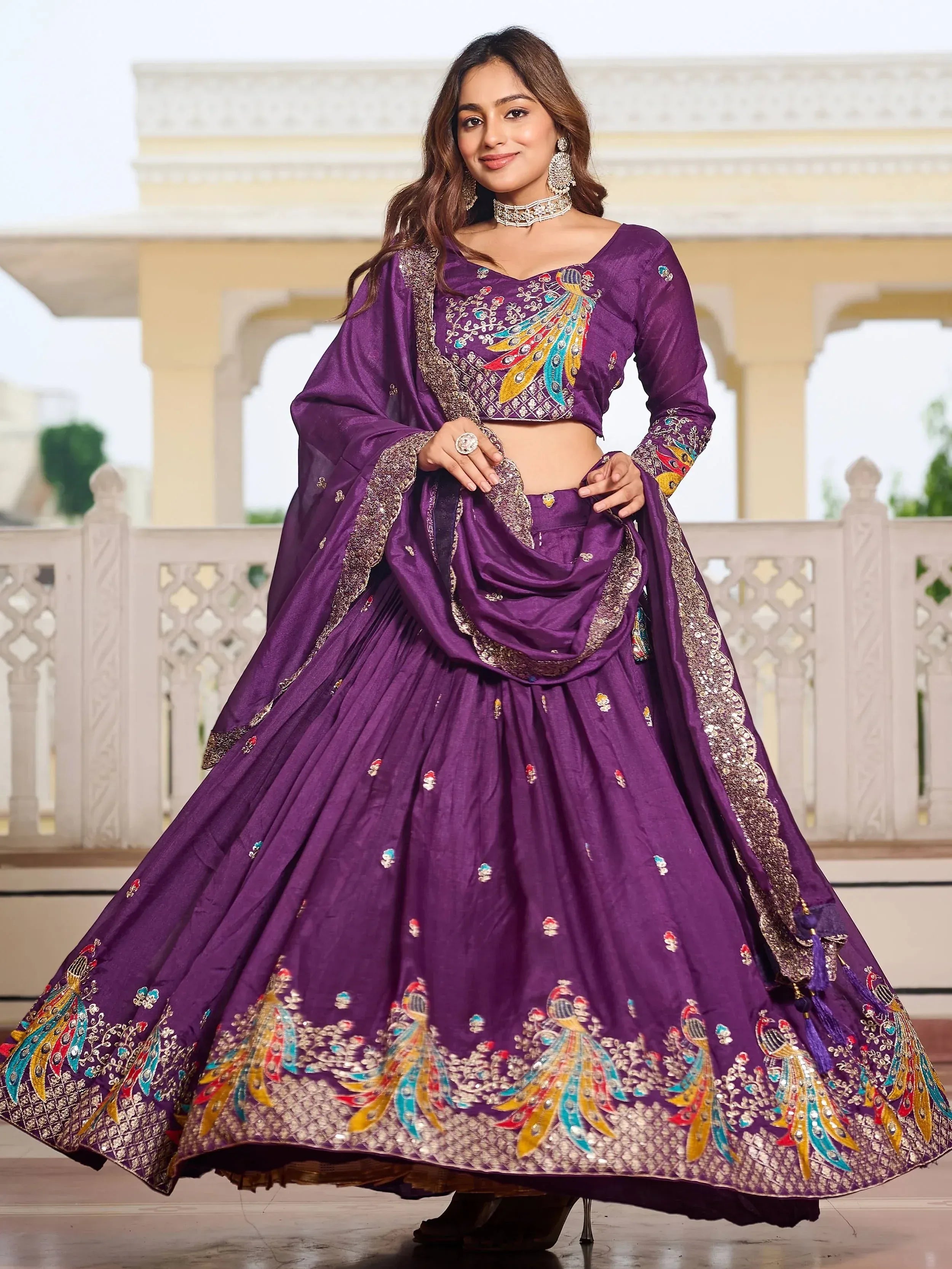 Purple designer lehenga choli with peacock embroidery, perfect for Indian weddings and festive occasions.