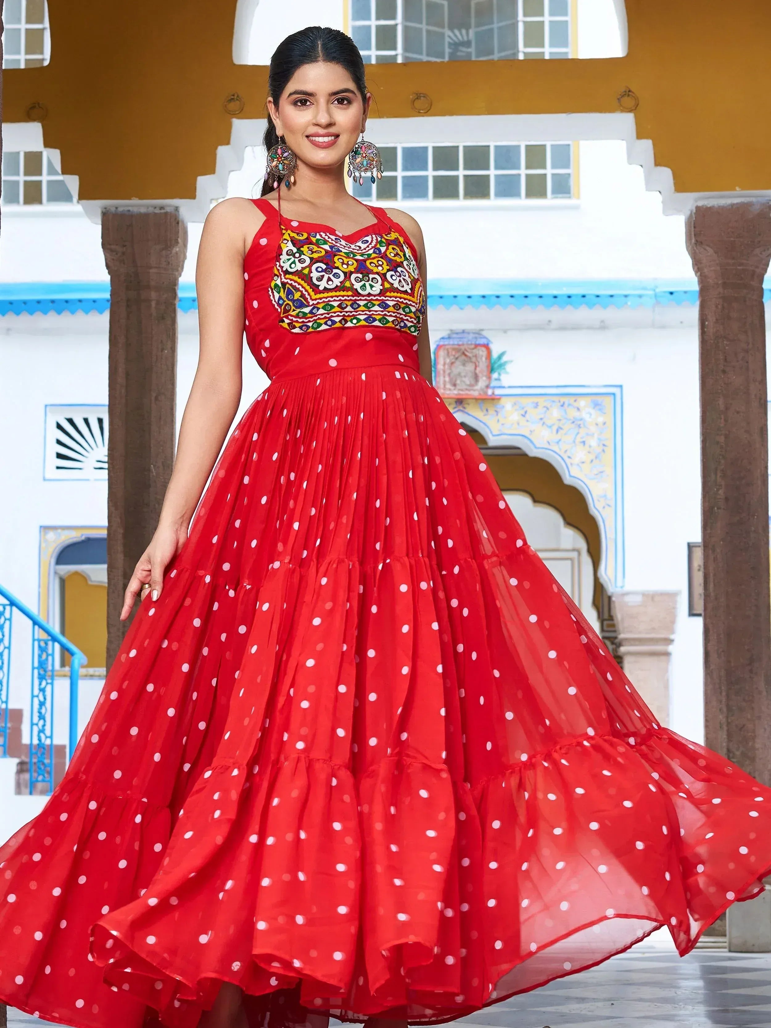 Red polka dot ethnic gown with colorful embroidery, perfect for Indian festive occasions