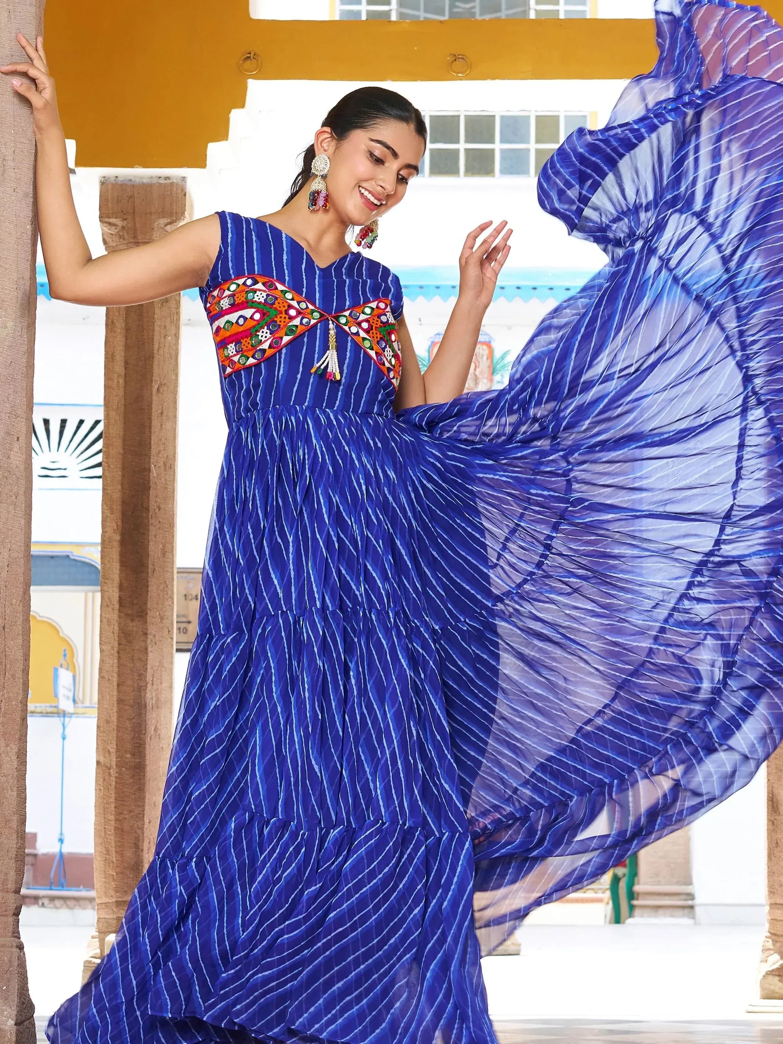 Blue striped ethnic gown with colorful mirror work, perfect for Indian occasions and festive wear.