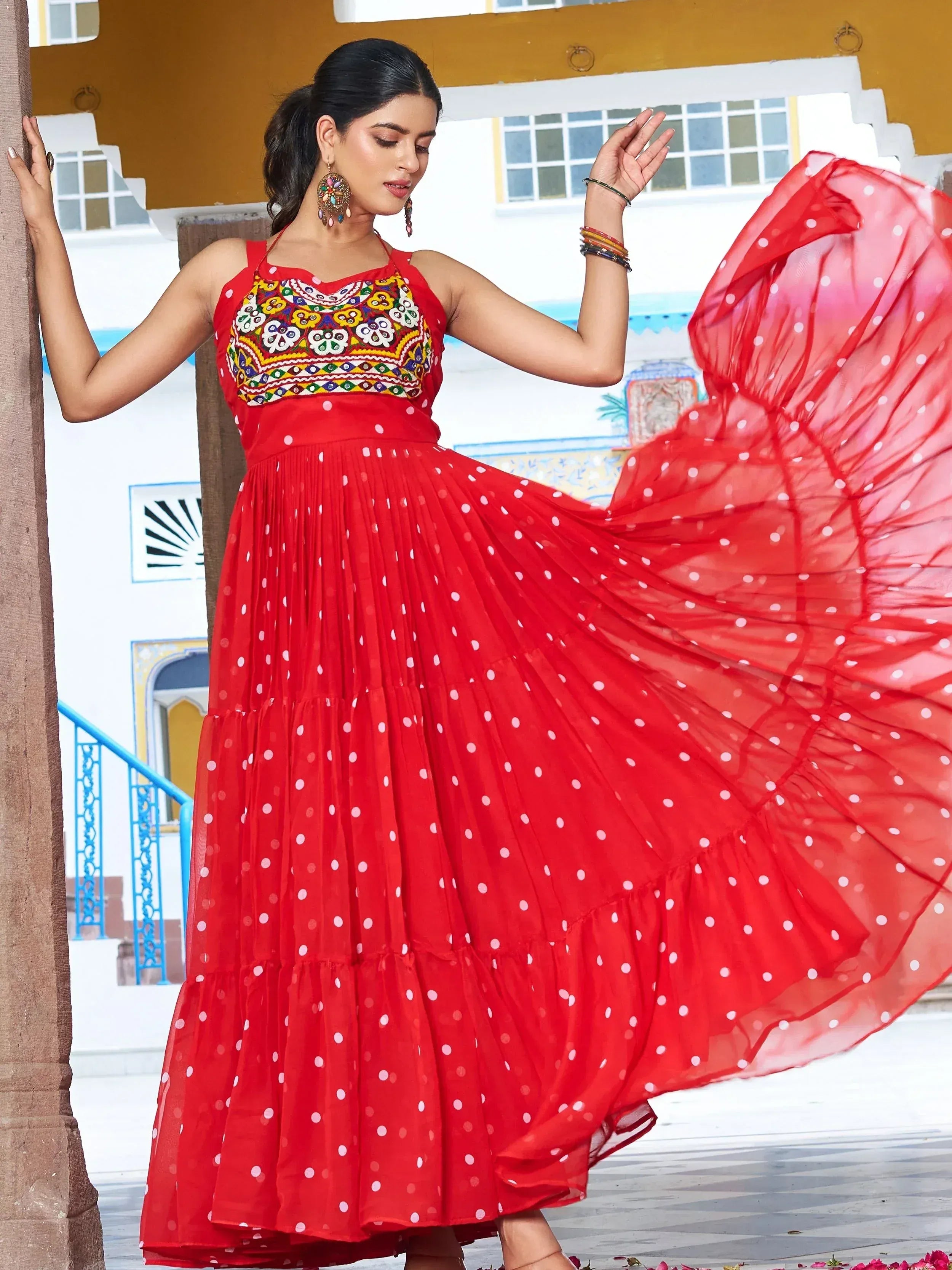 Red polka dot ethnic gown with colorful embroidery, perfect for Indian festive occasions