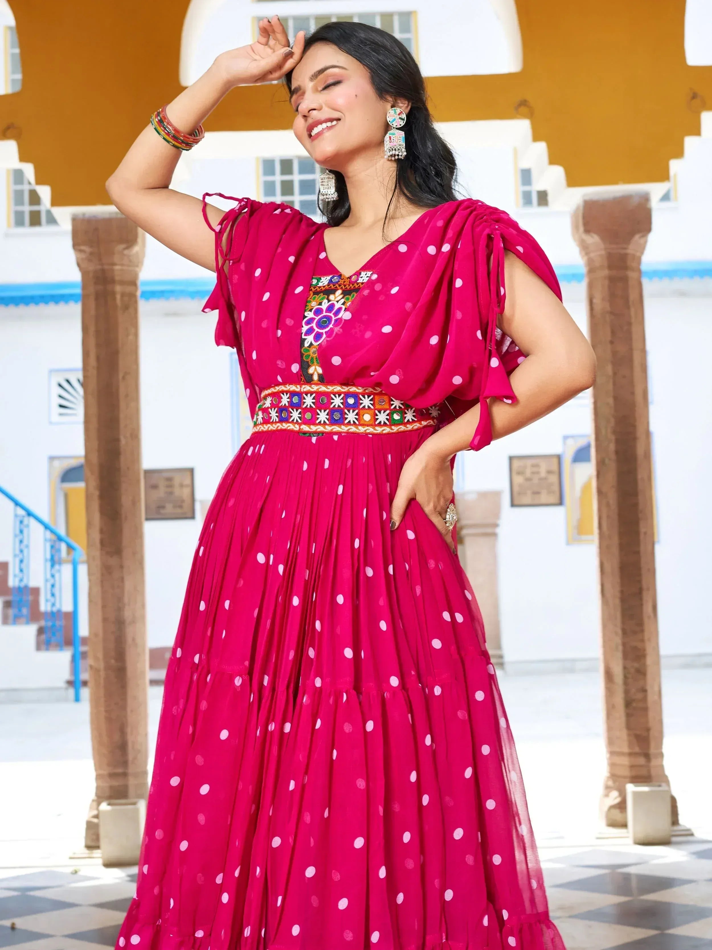 Pink polka dot ethnic gown with embroidery, perfect for Indian occasions and festive wear.