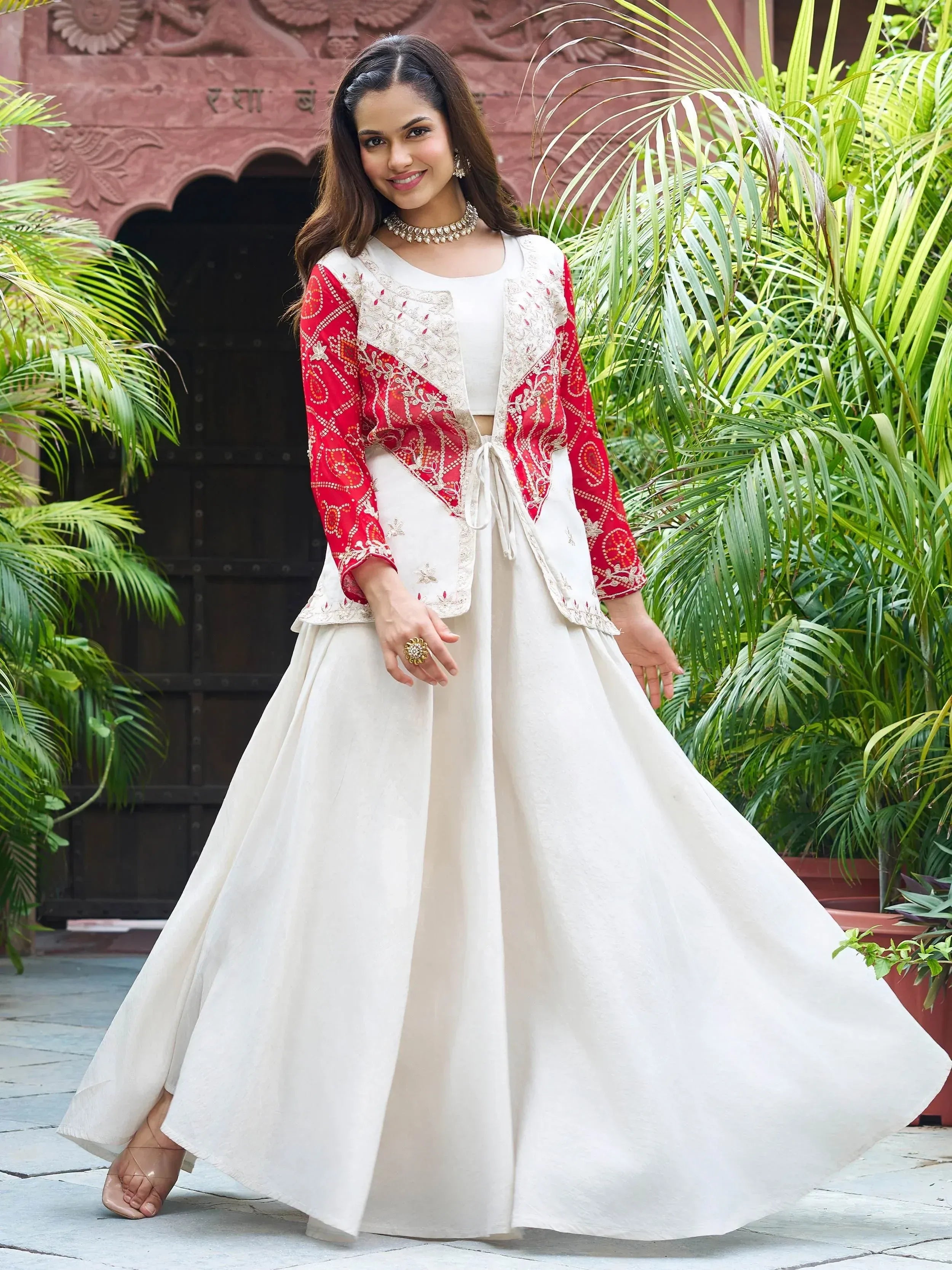 White ethnic gown with red embroidered jacket, perfect for Indian festive occasions and weddings