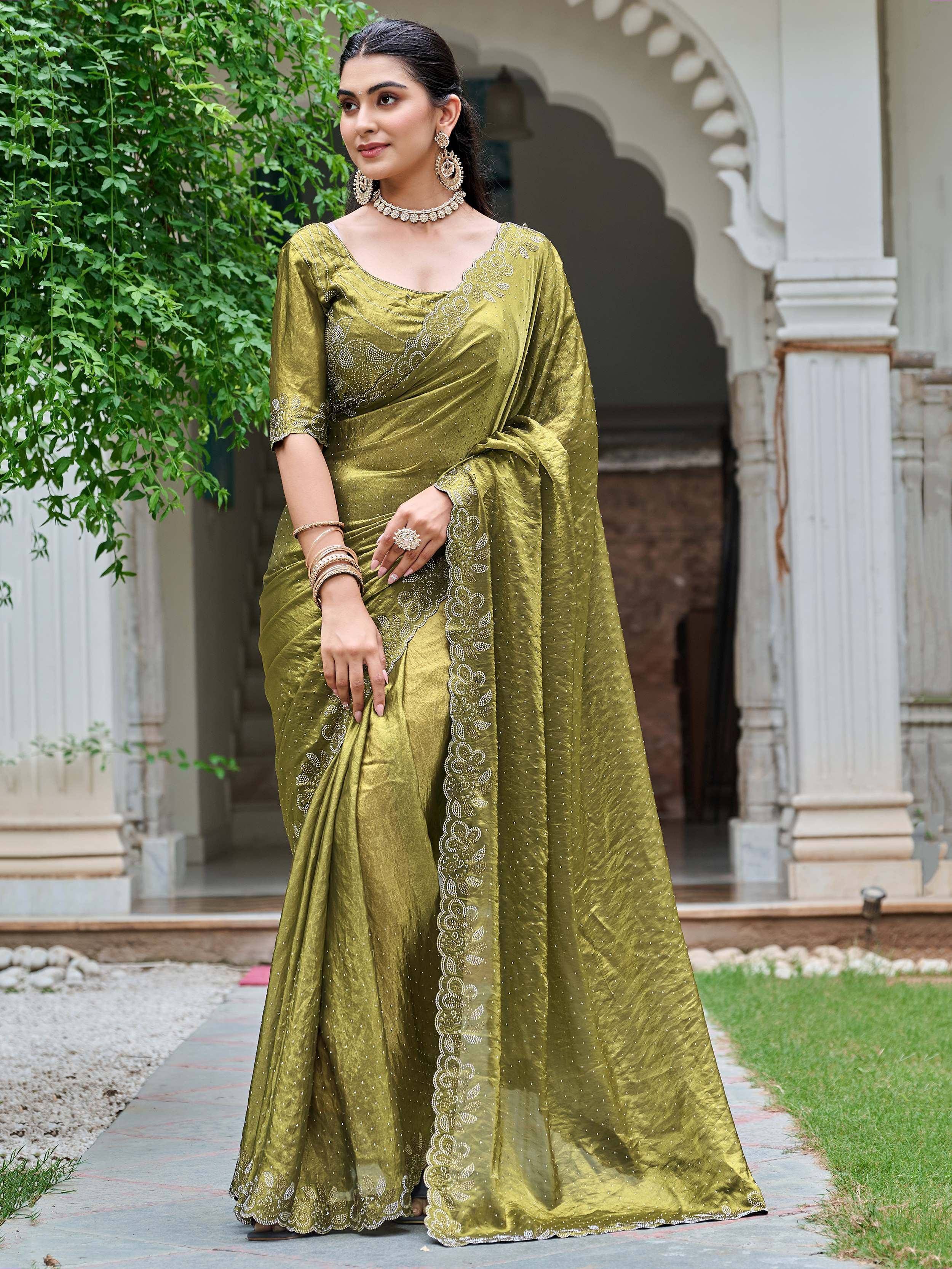 Olive green designer saree with intricate embroidery and embellishments, perfect for ethnic occasions.