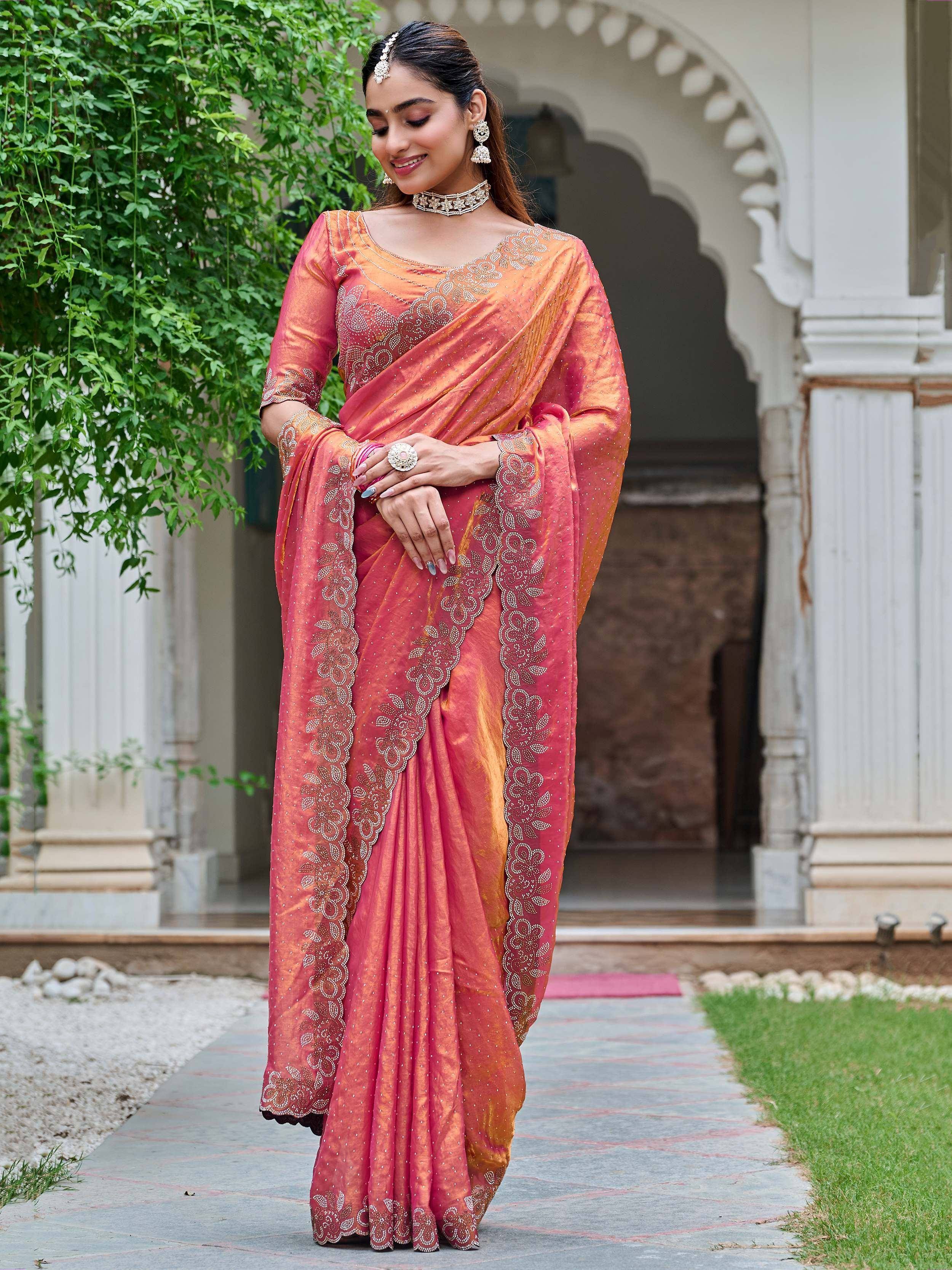 Elegant pink and orange designer saree with floral embroidery, perfect for Indian ethnic occasions.