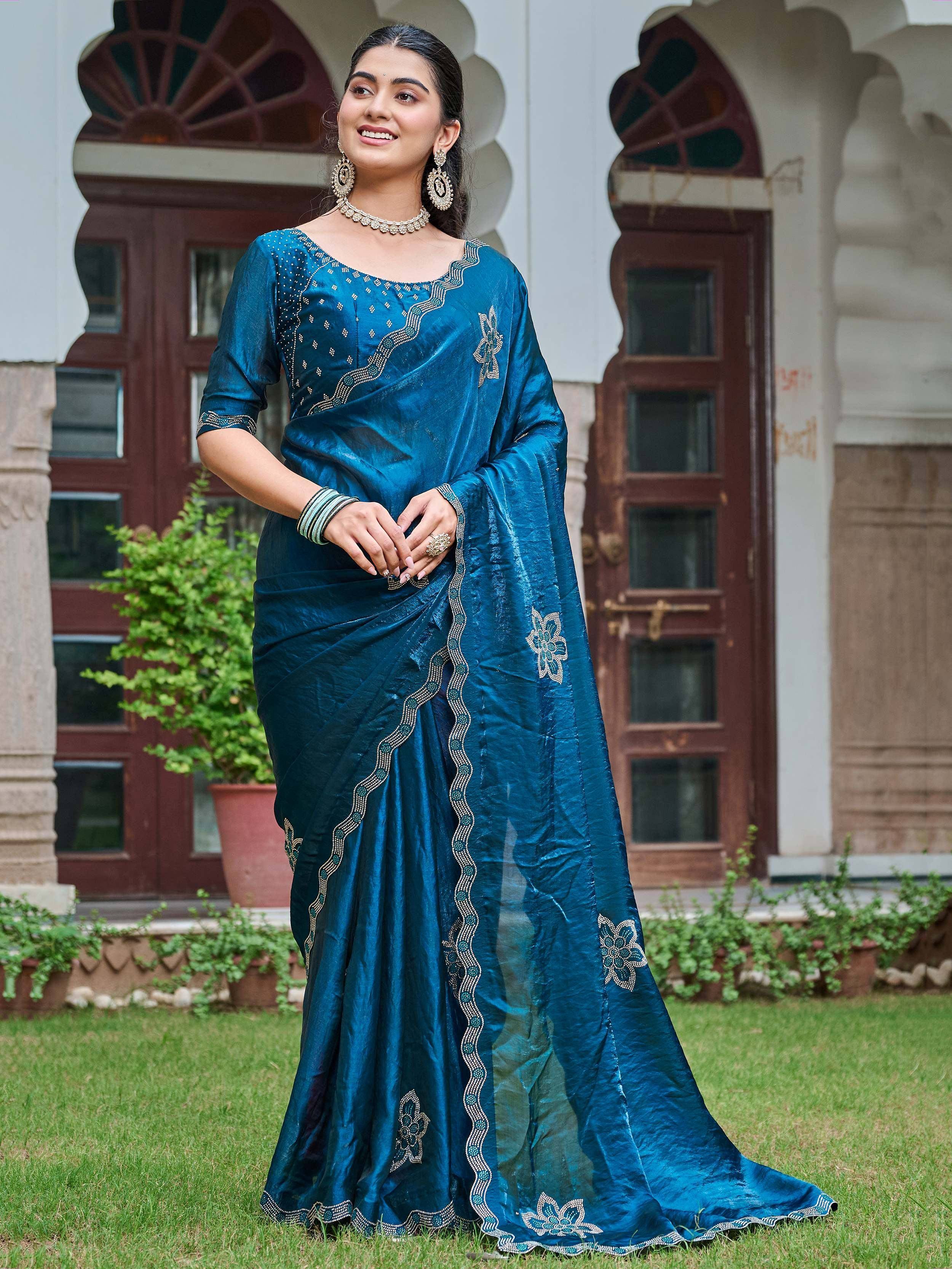 Teal blue embroidered saree with gold detailing, perfect for Indian ethnic occasions and festive wear.