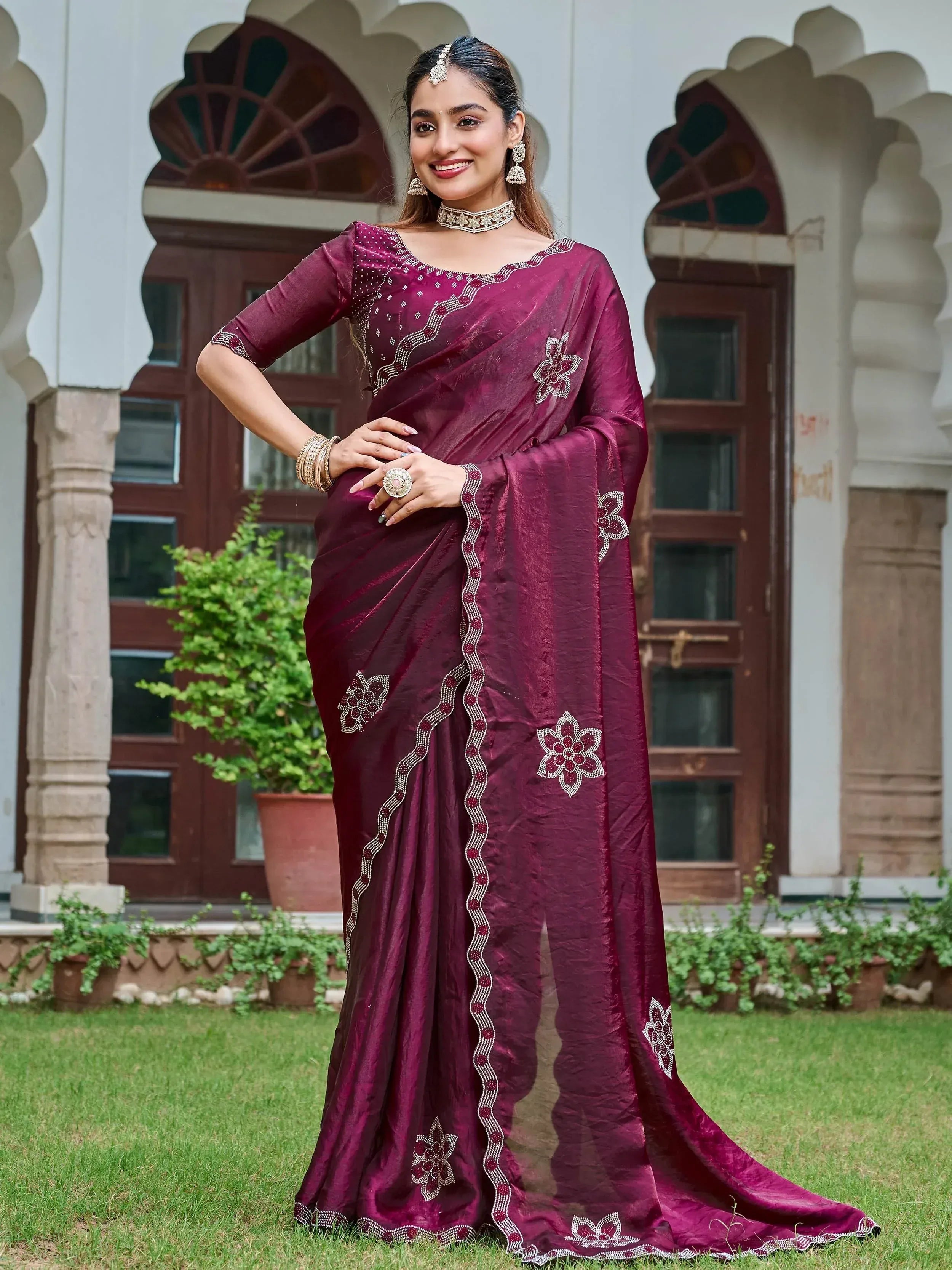 Elegant maroon saree with floral embroidery and embellished border, perfect for Indian ethnic occasions