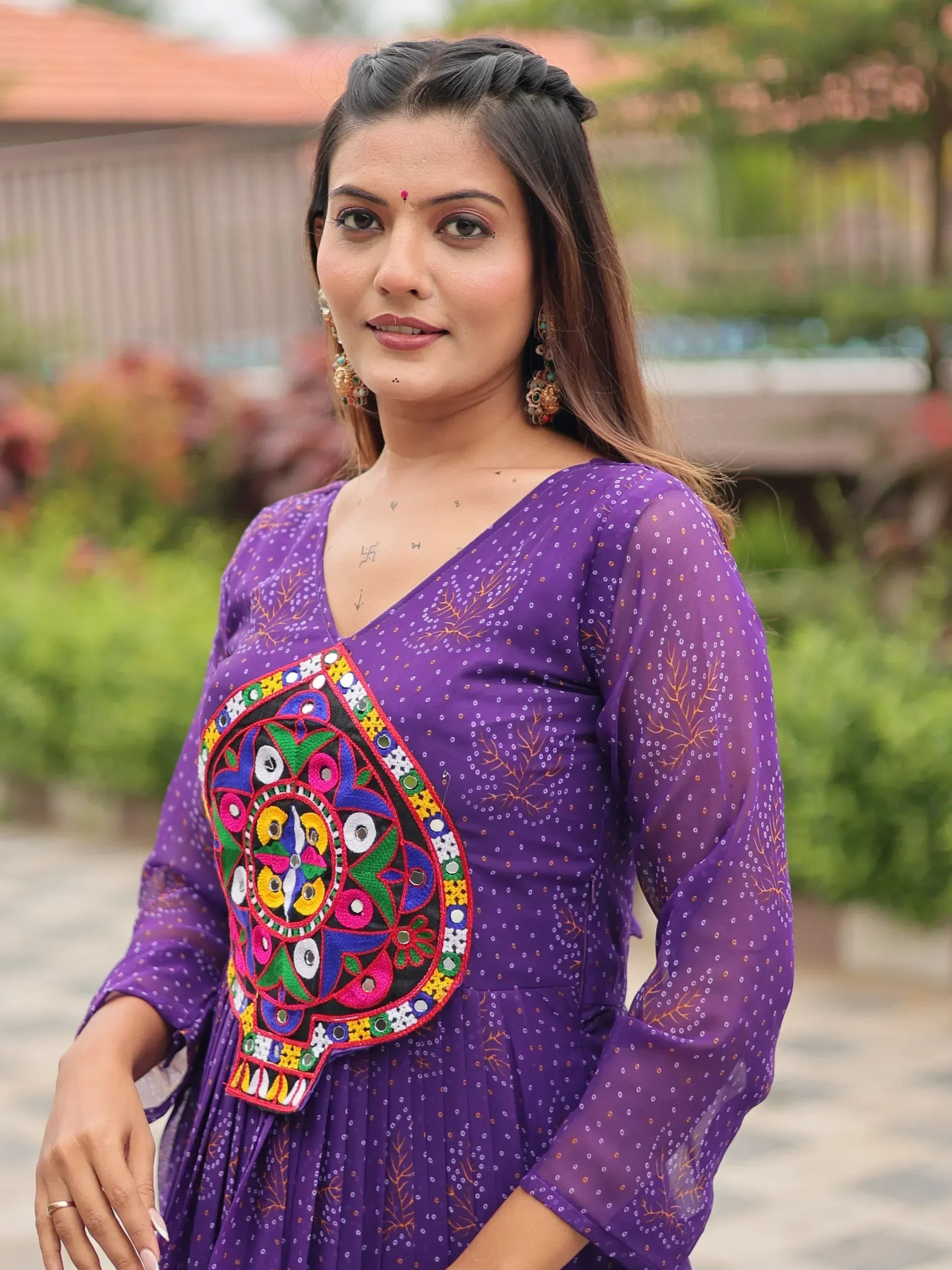 Purple ethnic kurti with colorful mirror work and embroidery, perfect for festive occasions