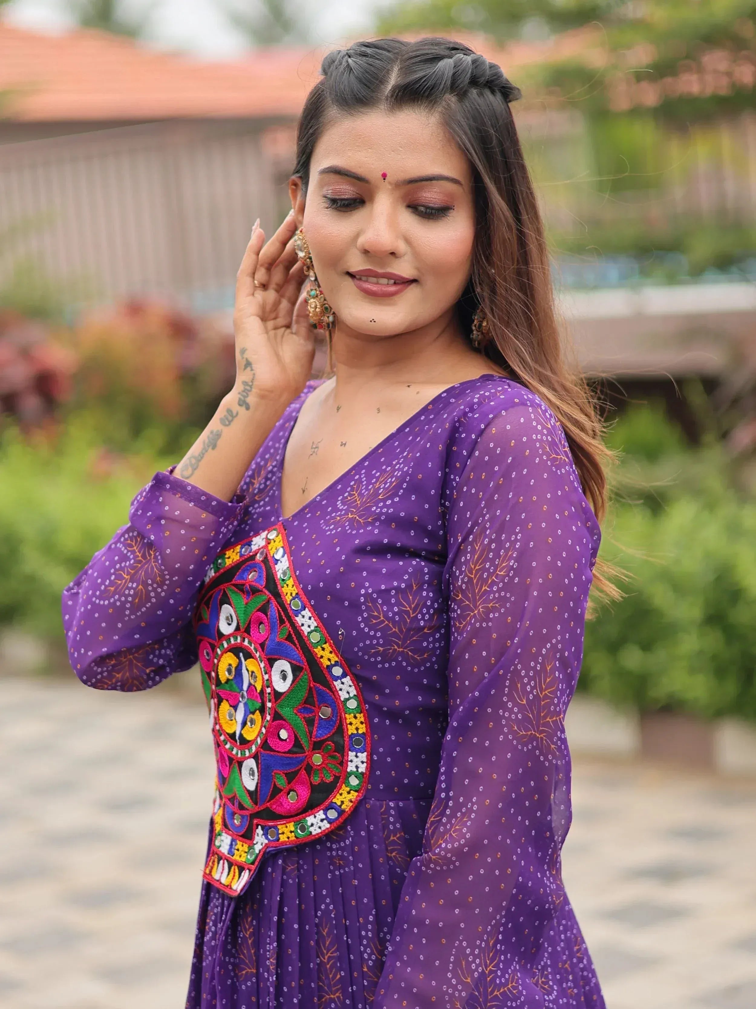 Purple ethnic gown with colorful embroidery, perfect for Indian festive wear