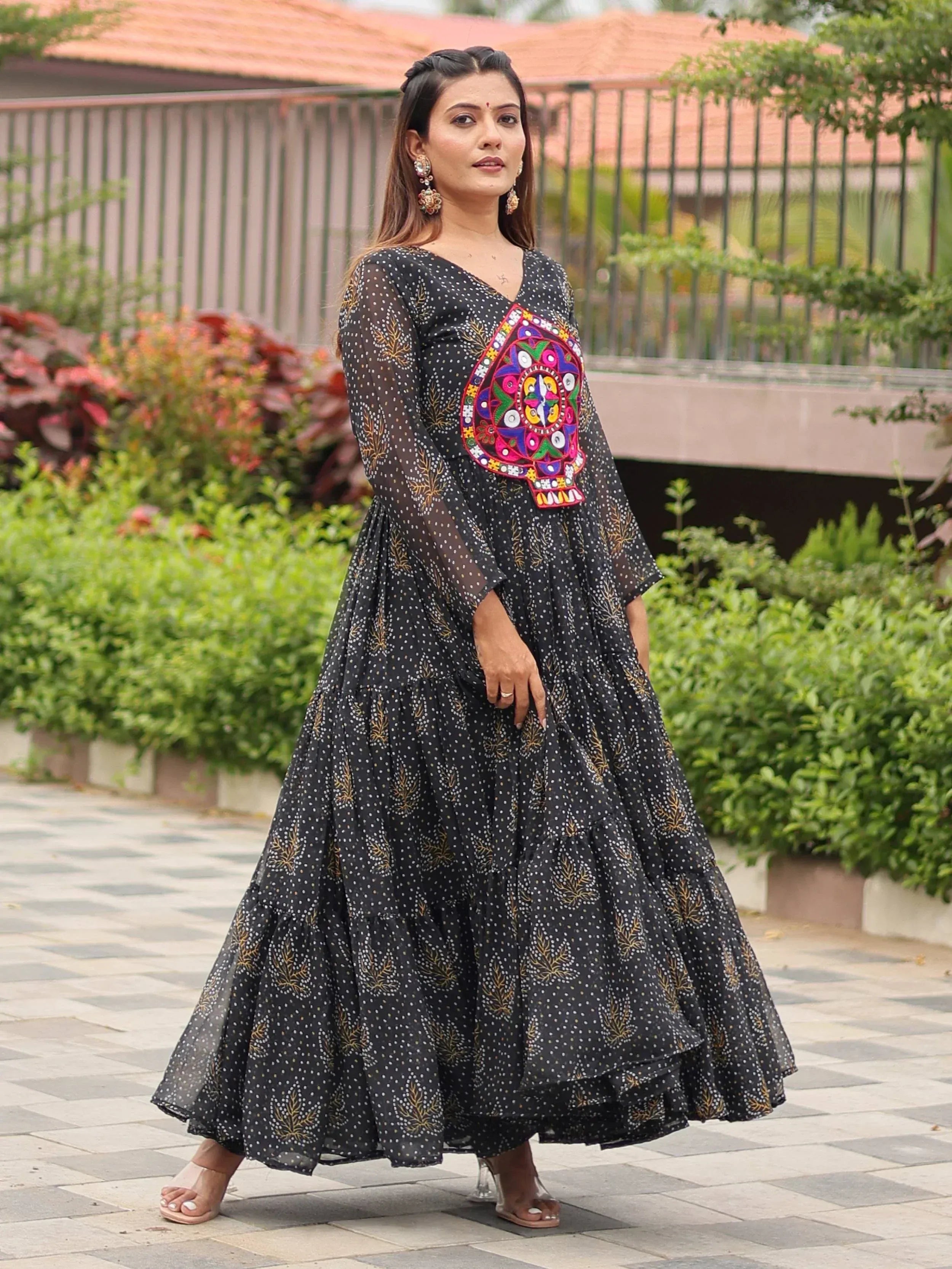 Black ethnic gown with colorful mirror work, polka dots, and tiered skirt for women