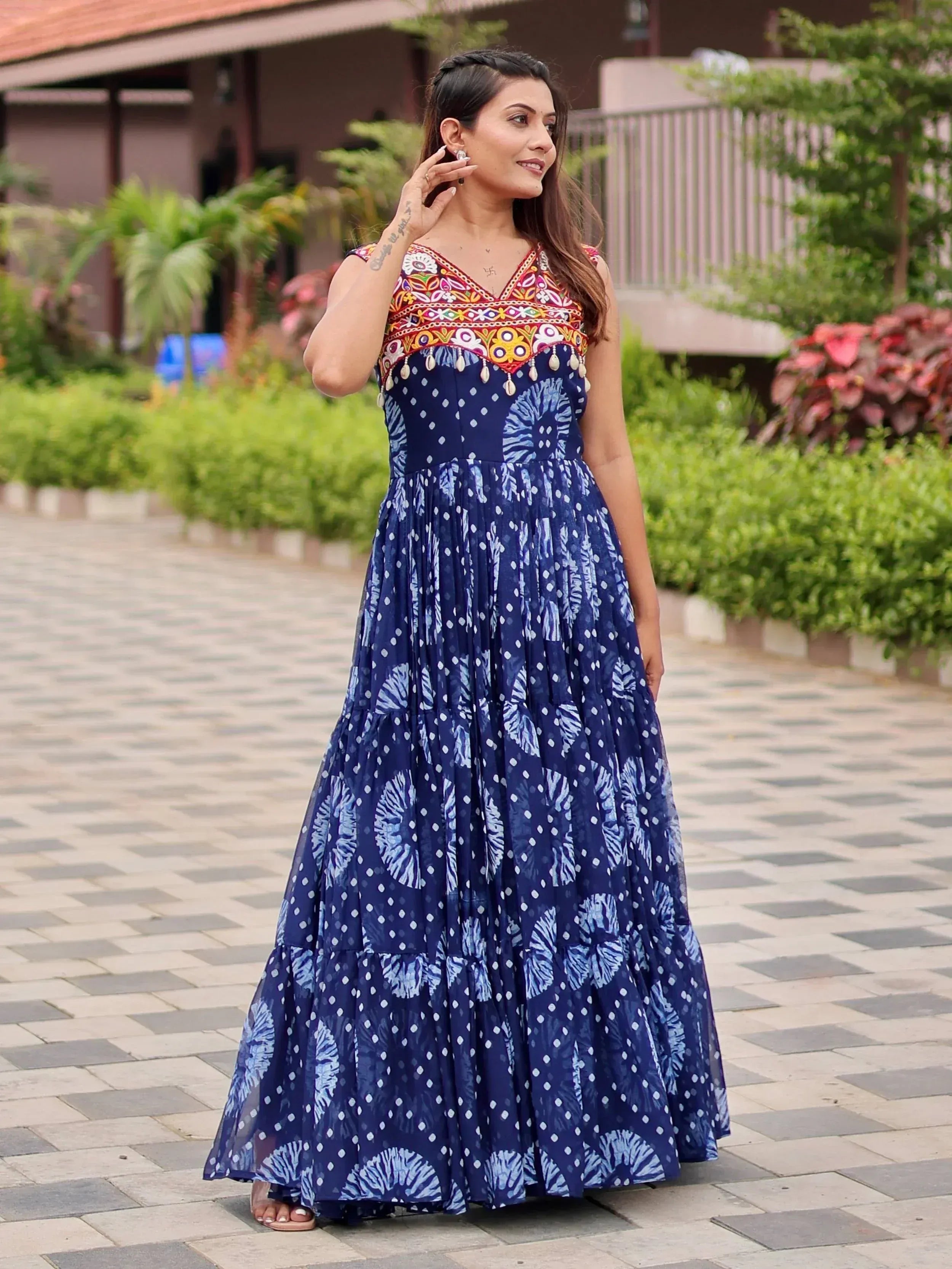 Blue ethnic gown with colorful embroidery and tie-dye print, perfect for Indian occasions
