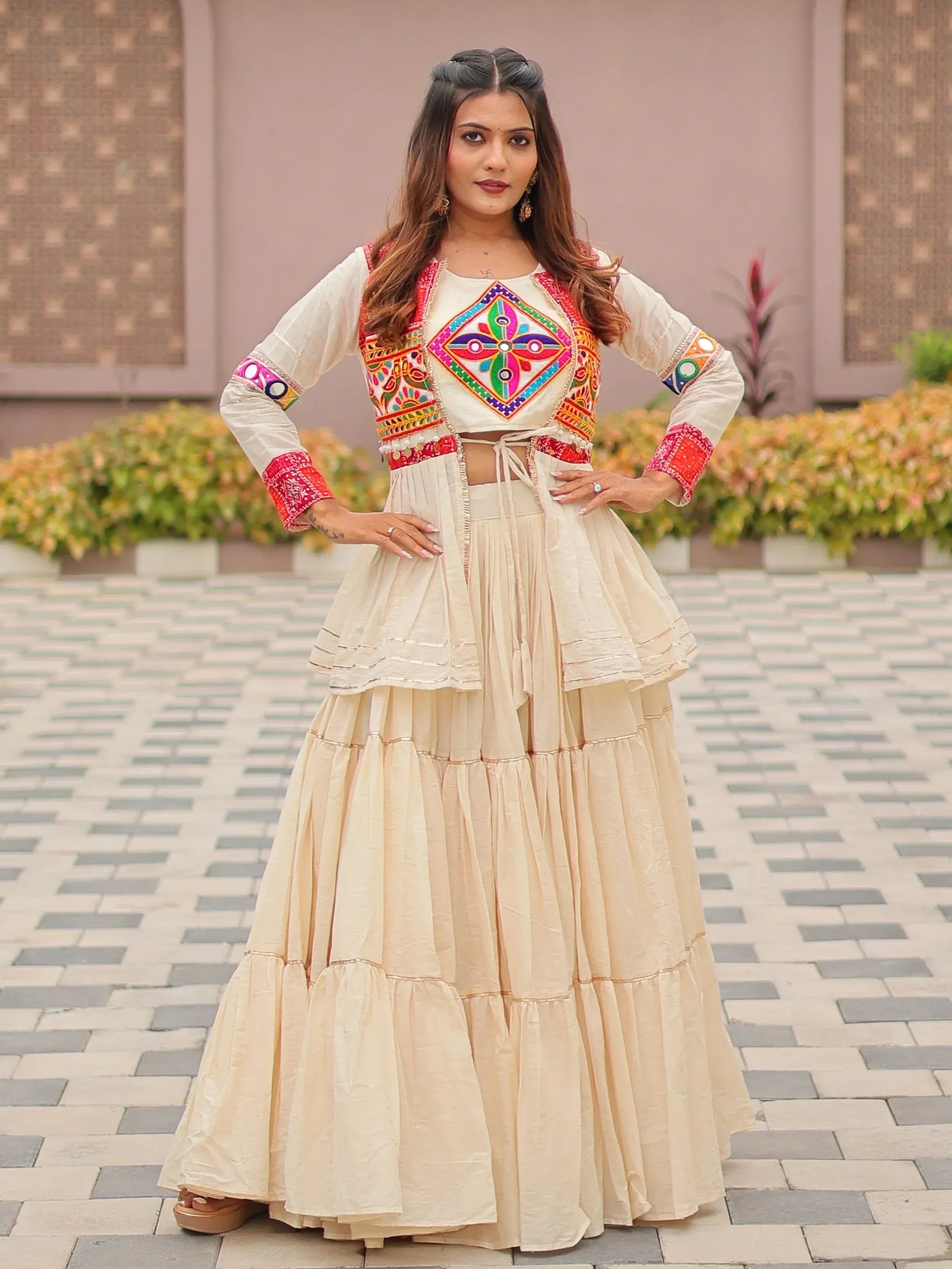 Cream embroidered lehenga choli with colorful mirror work, perfect for Indian ethnic wear occasions
